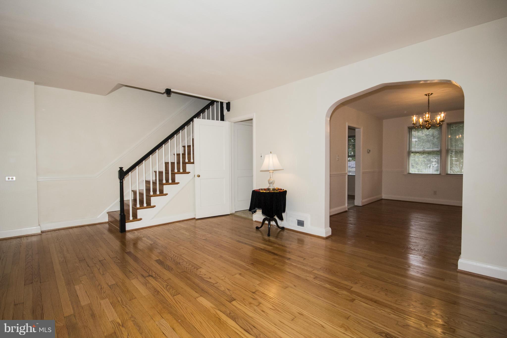 5626 Sagra Road Baltimore, MD 21239 - Photo 5 of 27 a view of a room with wooden floor and stairs