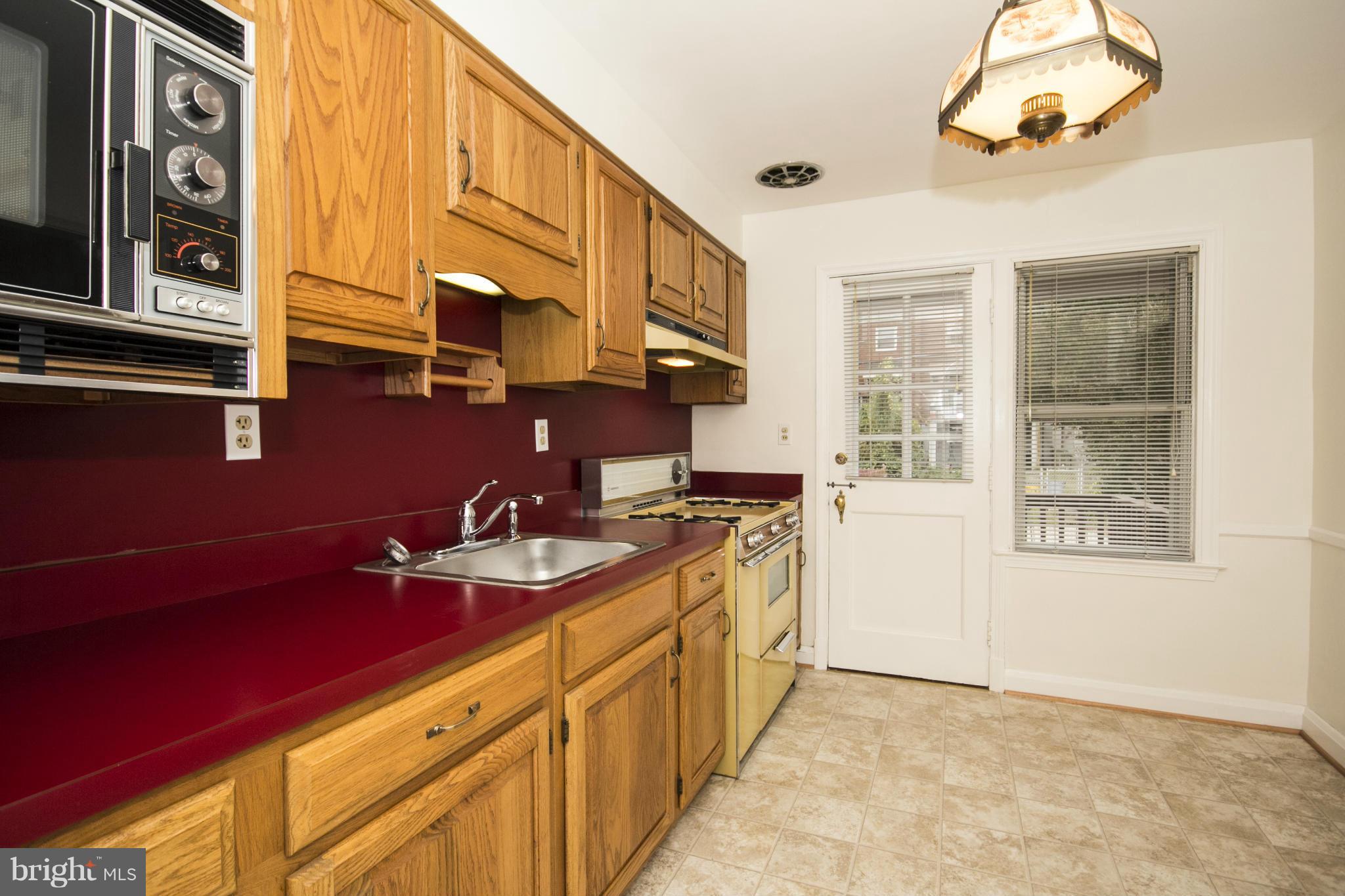 5626 Sagra Road Baltimore, MD 21239 - Photo 8 of 27 a bathroom with a sink a mirror and a shower