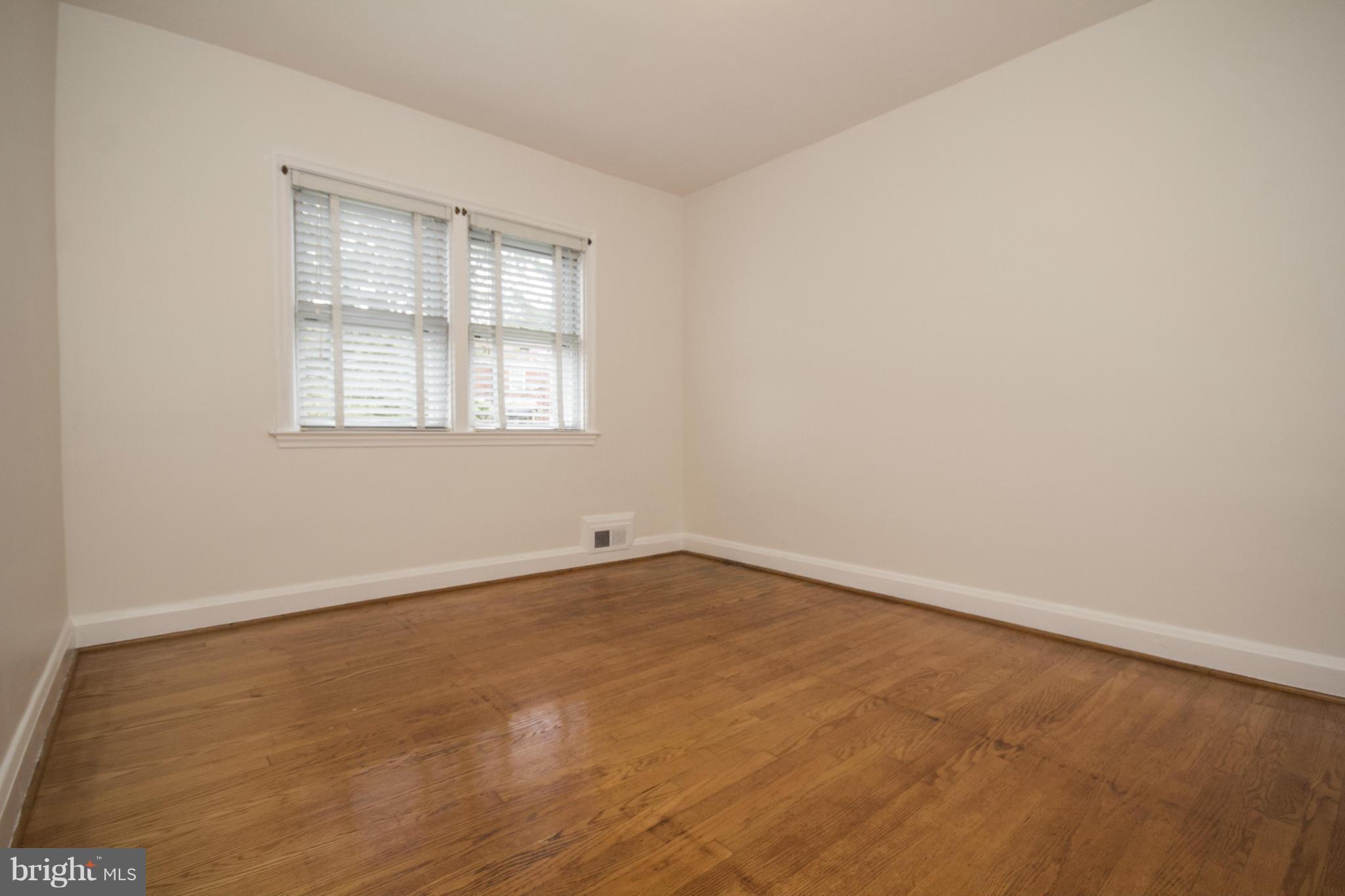 5626 Sagra Road Baltimore, MD 21239 - Photo 10 of 27 an empty room with a window