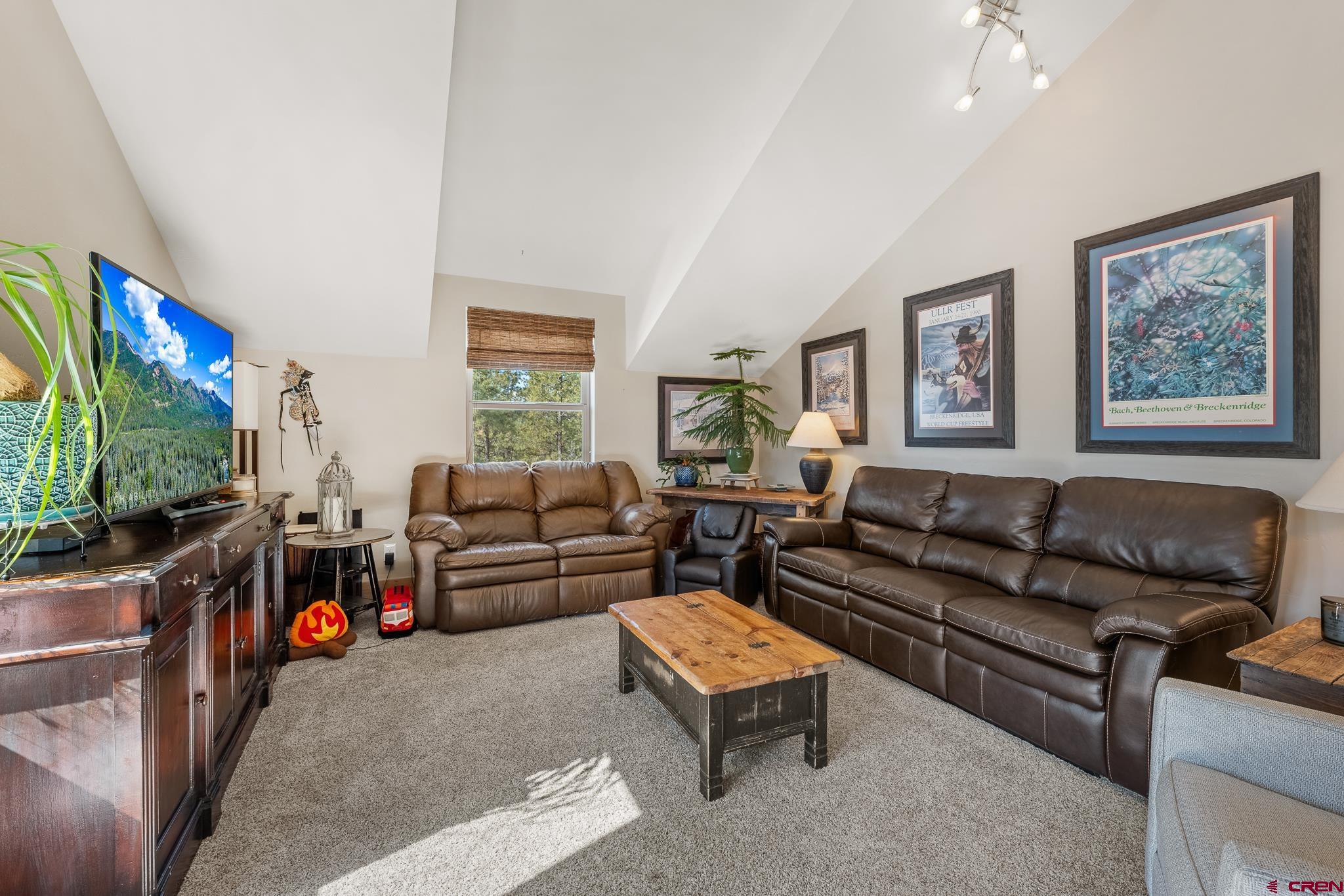 51 West Fork Road Durango, CO 81303 - Photo 16 of 35 a living room with furniture and a flat screen tv
