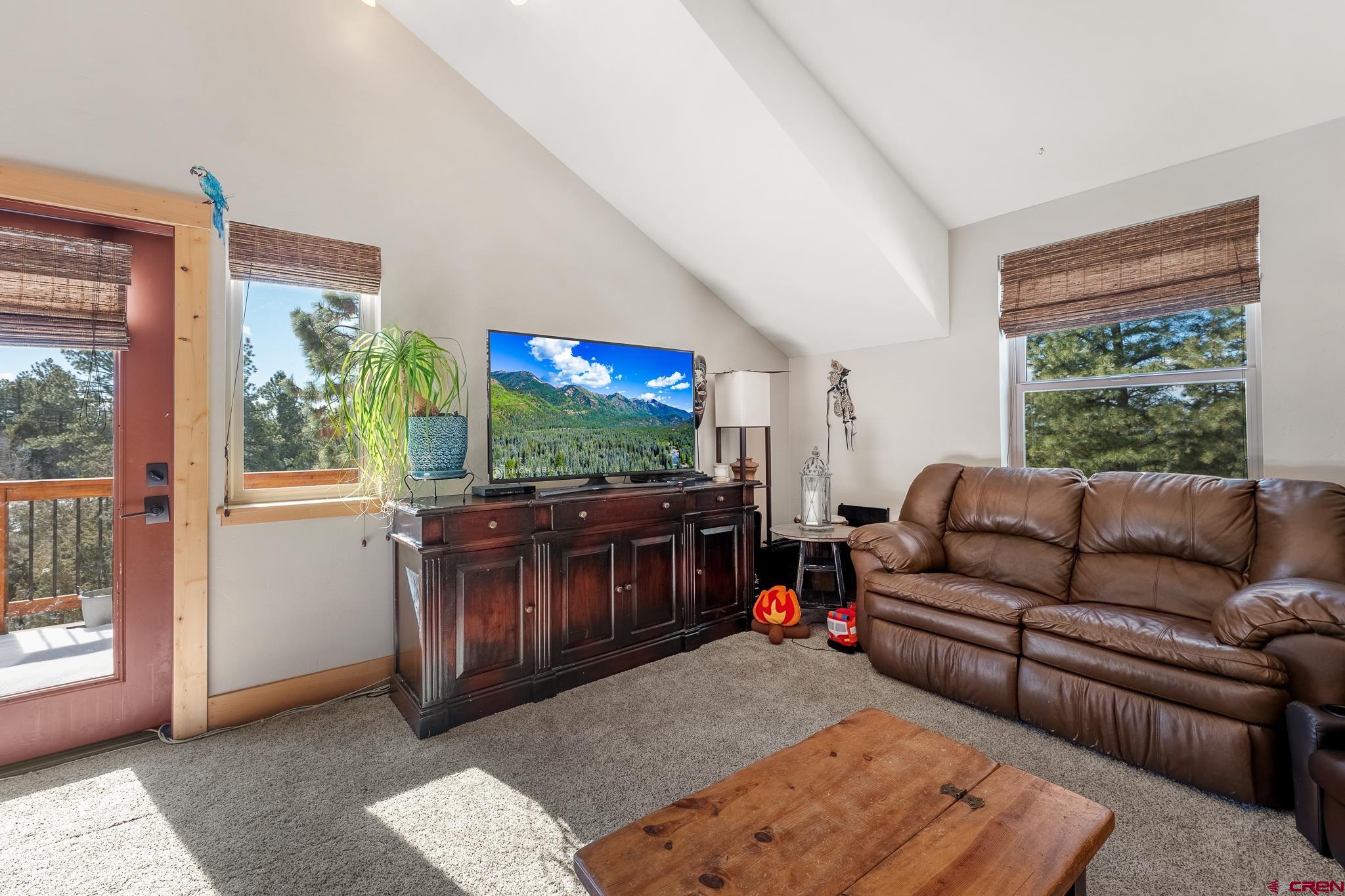 51 West Fork Road Durango, CO 81303 - Photo 17 of 35 a living room with furniture and a flat screen tv