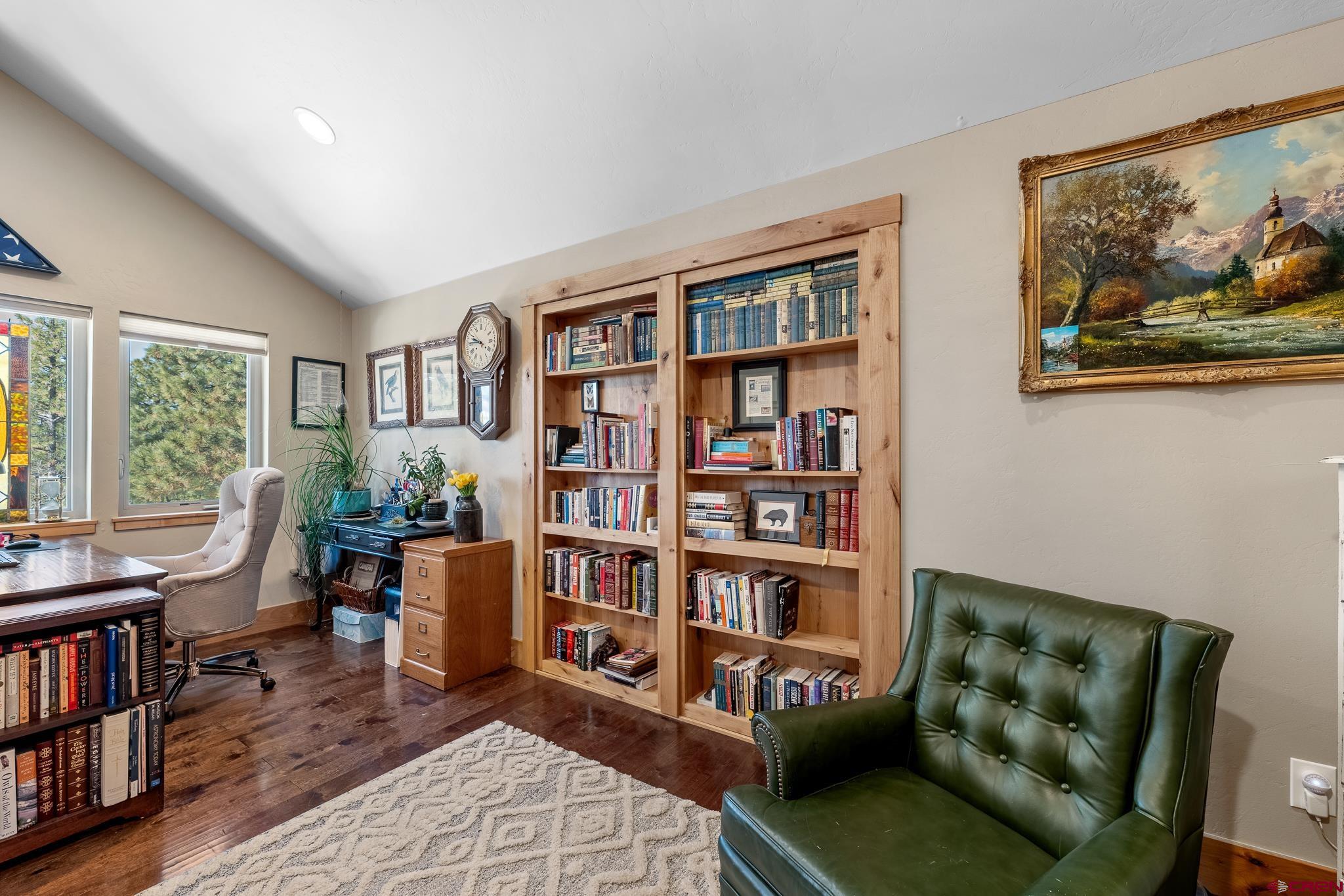 51 West Fork Road Durango, CO 81303 - Photo 21 of 35 a living room with furniture and a book shelf