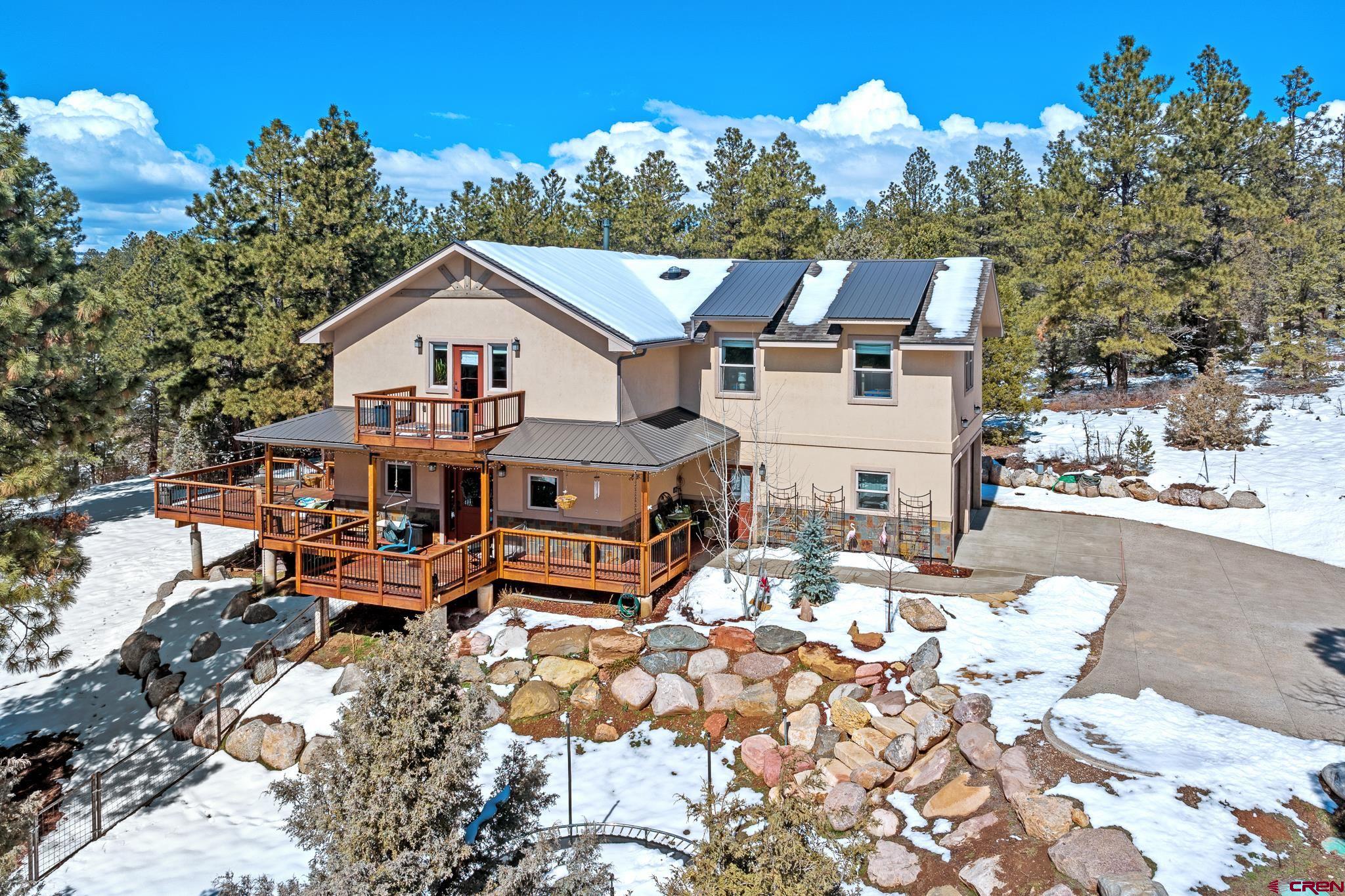 51 West Fork Road Durango, CO 81303 - Photo 3 of 35 a terrace of a house with outdoor seating