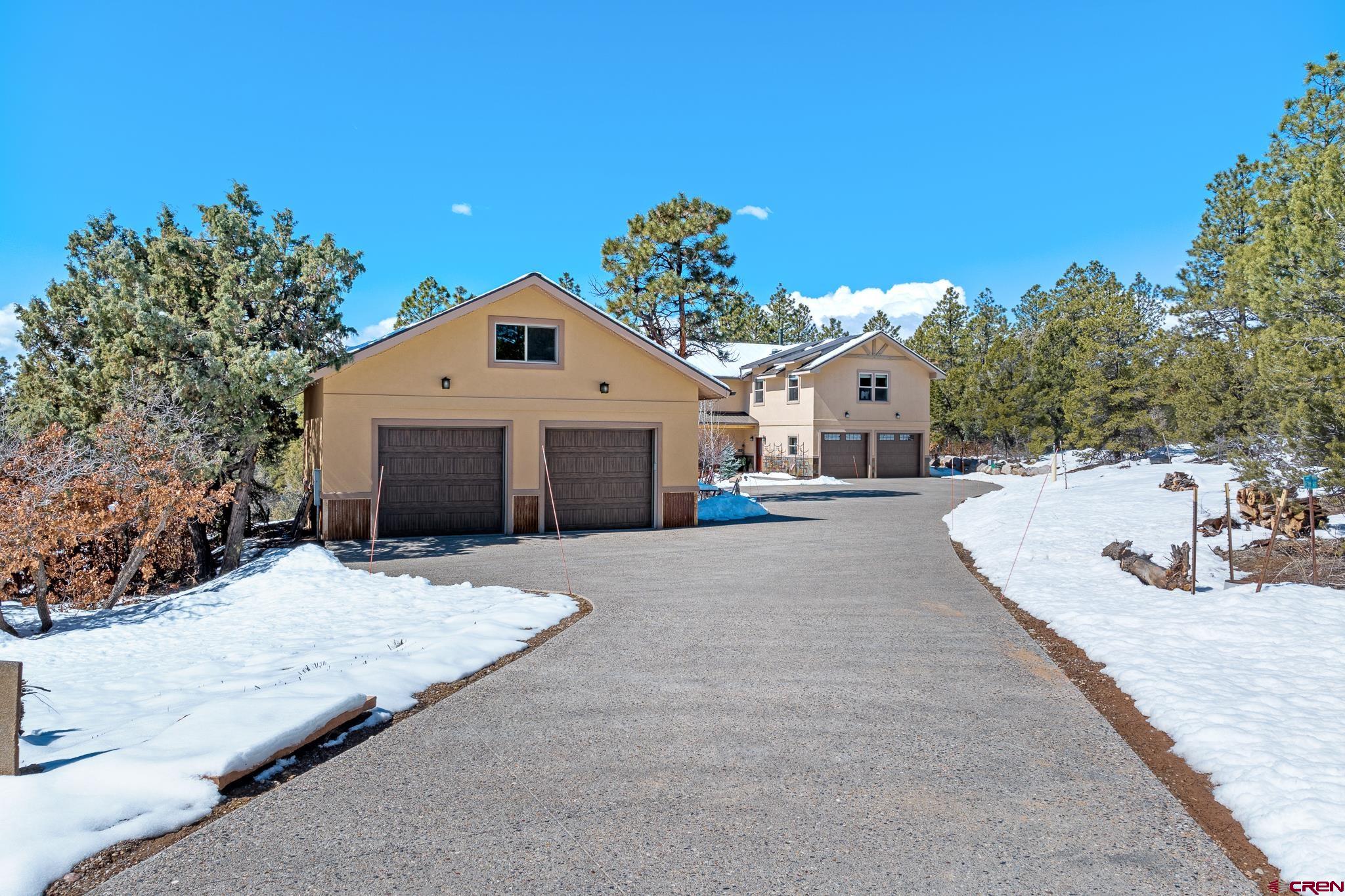 51 West Fork Road Durango, CO 81303 - Photo 4 of 35 a front view of a house with a yard