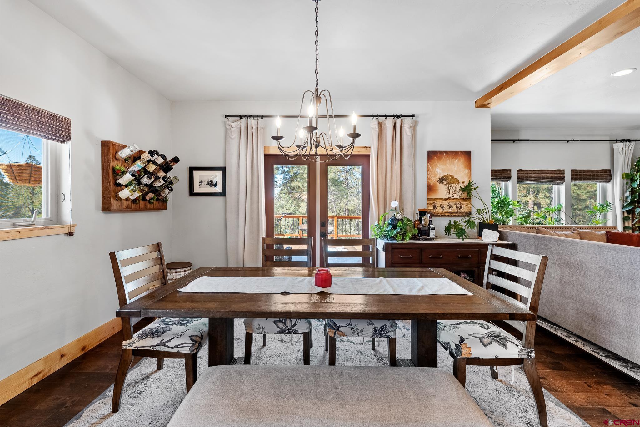 51 West Fork Road Durango, CO 81303 - Photo 10 of 35 a view of a dining room with furniture window and wooden floor