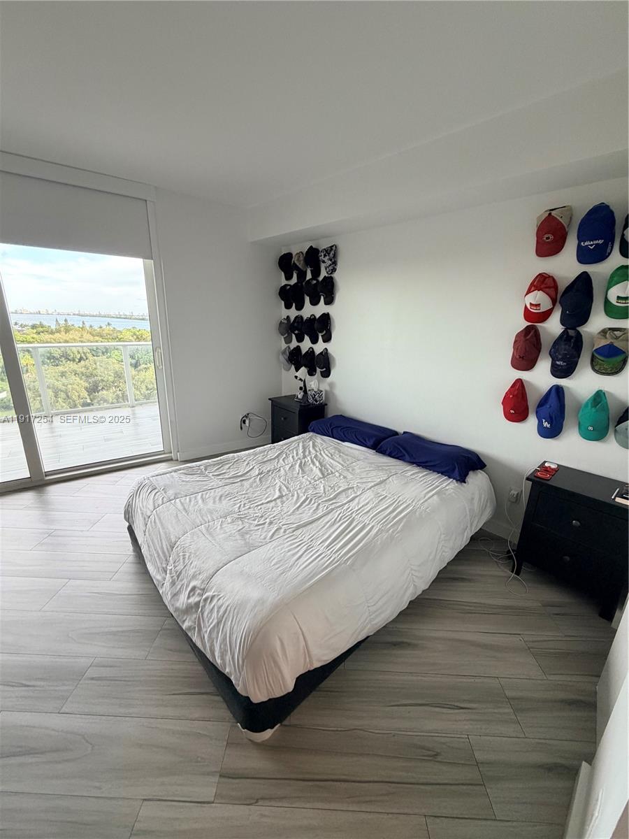 4250 Biscayne Boulevard, Unit 902 Miami, FL 33137 - Photo 13 of 30 a bedroom with a bed and a window