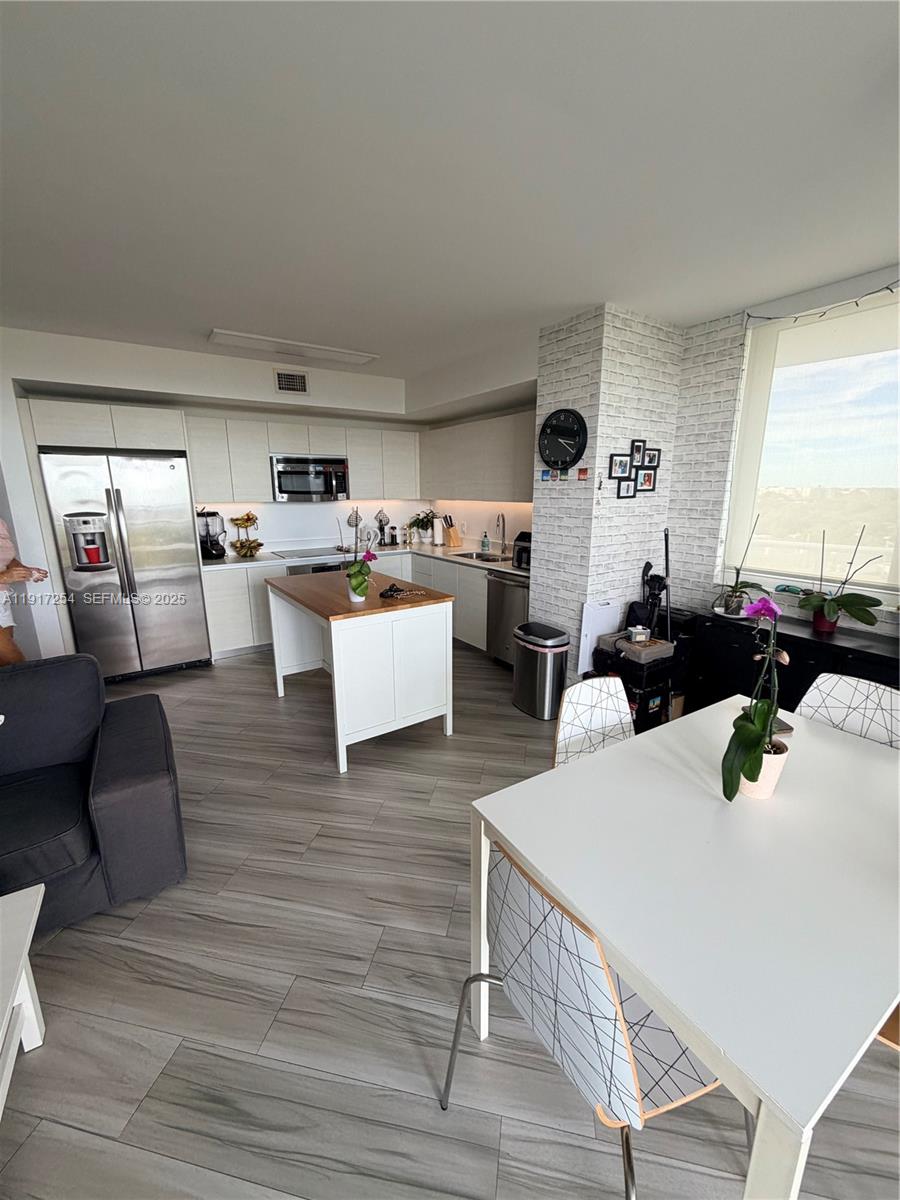 4250 Biscayne Boulevard, Unit 902 Miami, FL 33137 - Photo 22 of 30 a living room with furniture and a large window