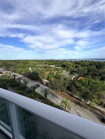 a view of balcony with furniture and city view