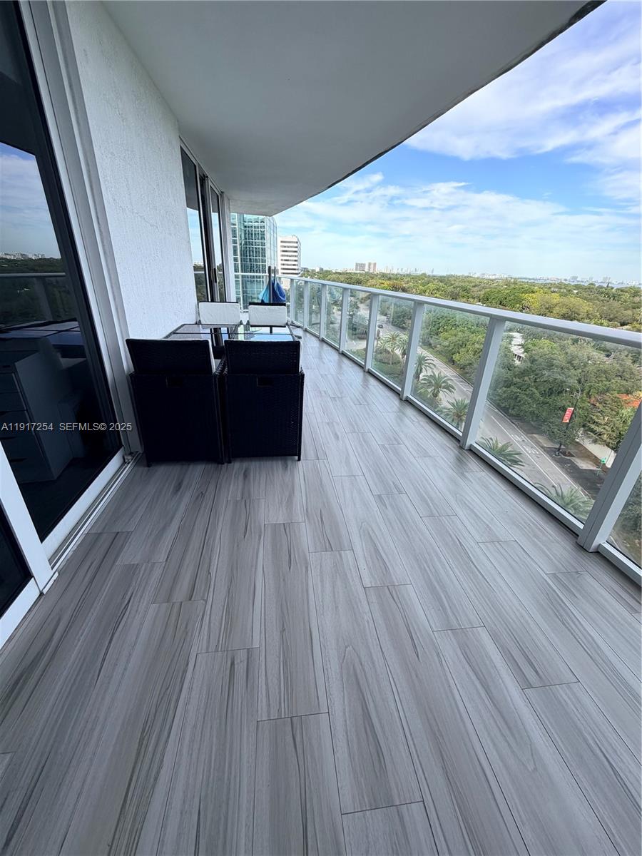 4250 Biscayne Boulevard, Unit 902 Miami, FL 33137 - Photo 5 of 30 a view of kitchen and wooden floor