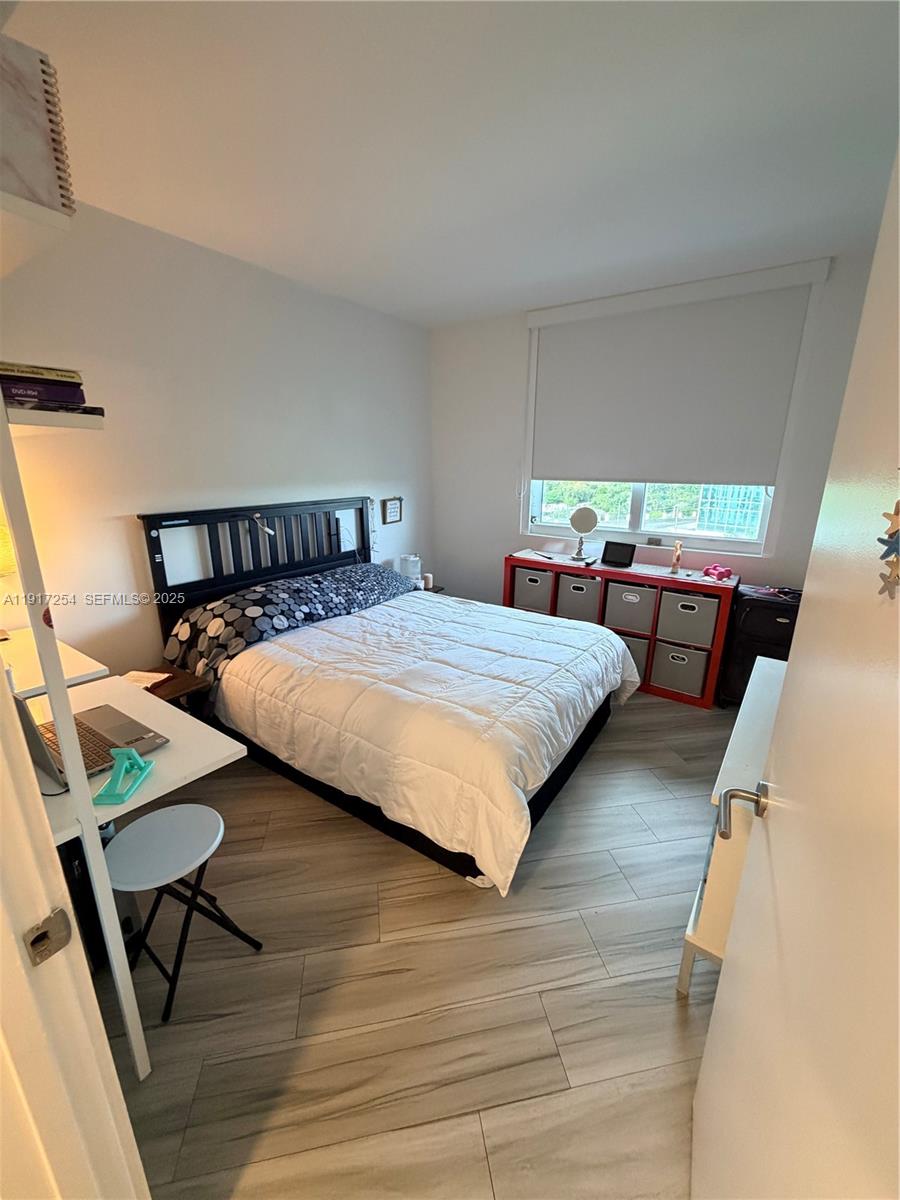 4250 Biscayne Boulevard, Unit 902 Miami, FL 33137 - Photo 9 of 30 a bedroom with double bed and window