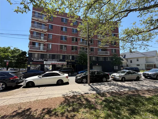 a view of a street with cars