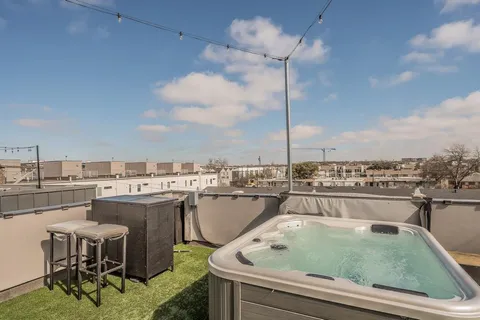 a view of a swimming pool and lounge chair