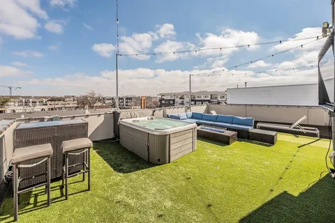 a view of a swimming pool with outdoor seating