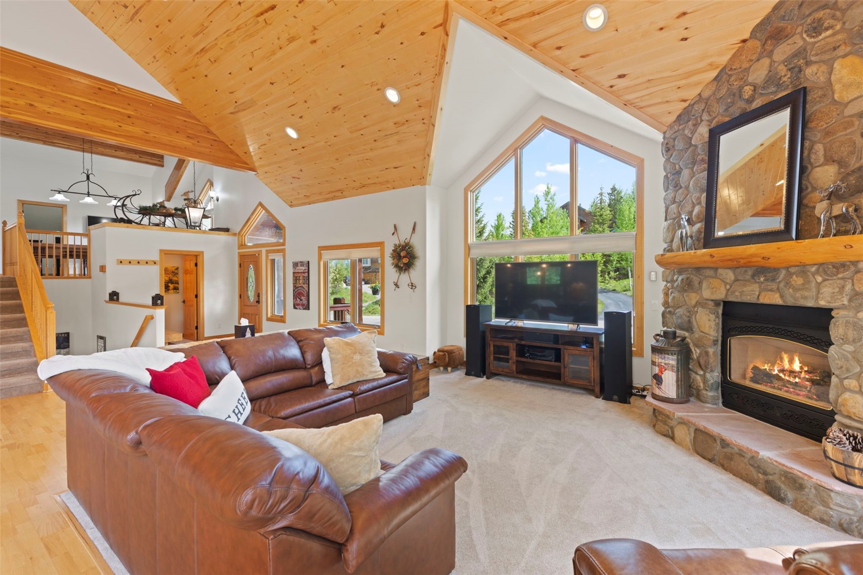 736 Wild Rose Road Silverthorne, CO 80498 - Photo 3 of 49 Living room with stairs, wooden ceiling, a fireplace, high vaulted ceiling, and recessed lighting
