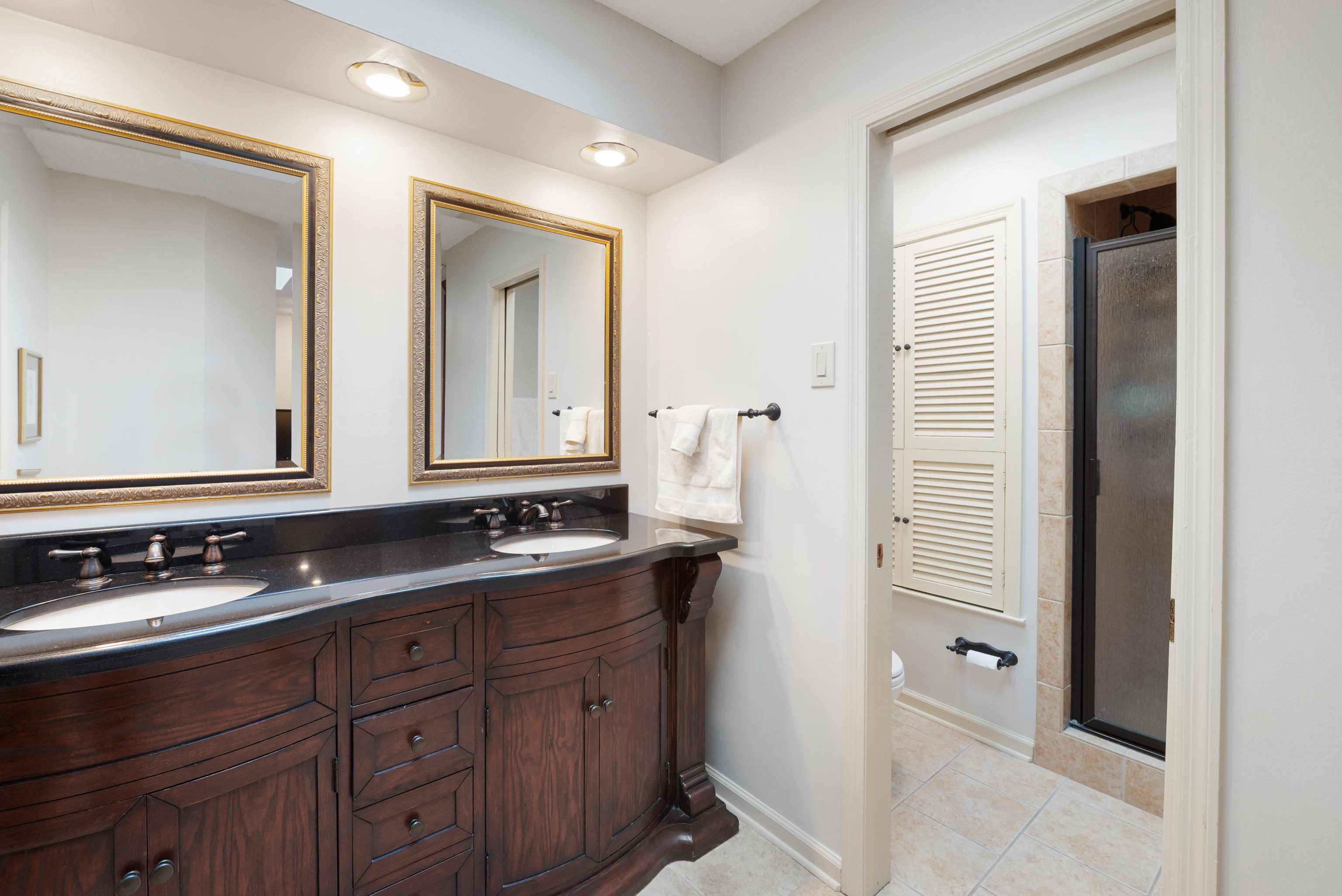 52 North Yates Road Memphis, TN 38120 - Photo 33 of 40 a bathroom with double sink and a mirror