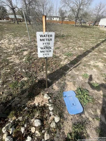 a sign board with view of lake
