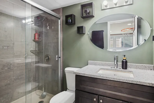 a bathroom with a sink and mirror