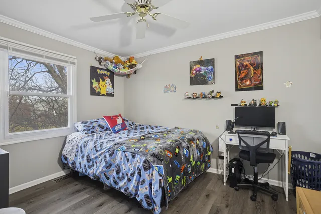 a bedroom with bed and a window