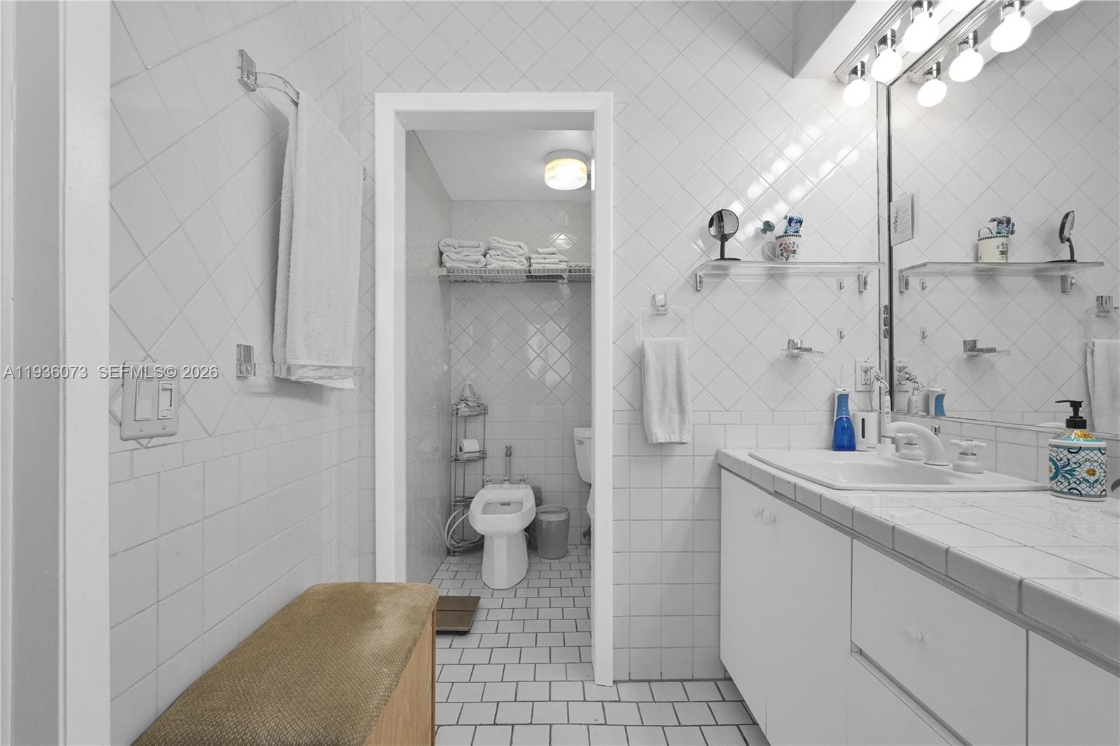 6551 Southwest 126th Street Pinecrest, FL 33156 - Photo 17 of 30 a bathroom with a sink a toilet and shower