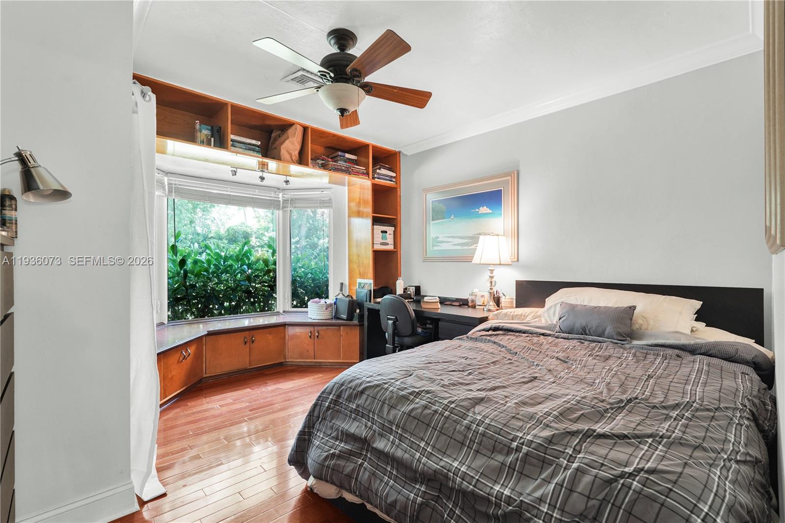 6551 Southwest 126th Street Pinecrest, FL 33156 - Photo 18 of 30 a bedroom with a large bed and a large window