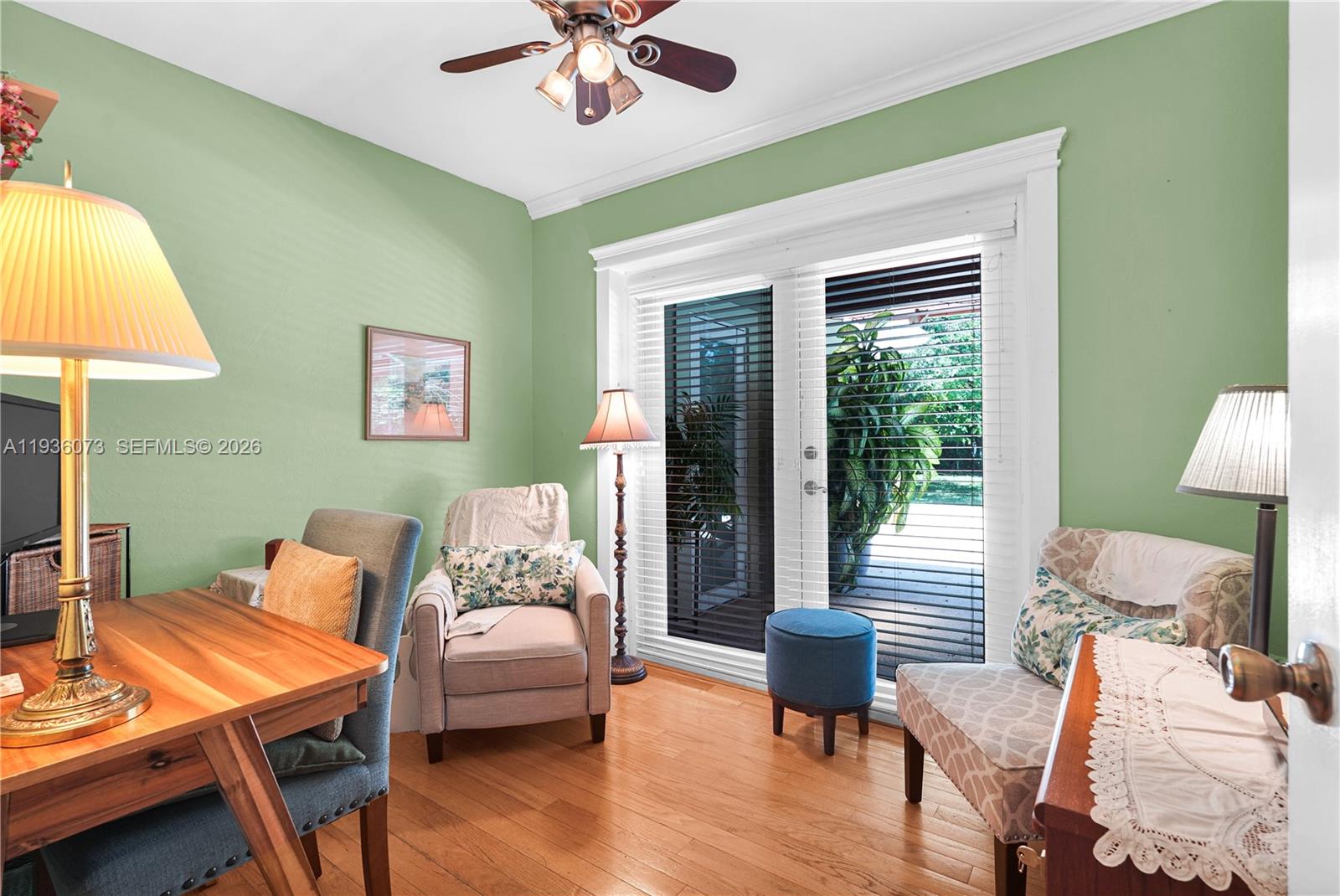 6551 Southwest 126th Street Pinecrest, FL 33156 - Photo 22 of 30 a living room with furniture and a lamp
