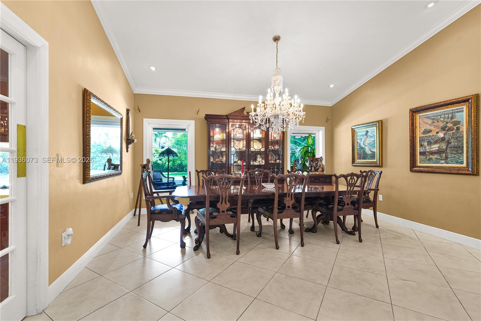 6551 Southwest 126th Street Pinecrest, FL 33156 - Photo 5 of 30 a view of a dining room with furniture and chandelier