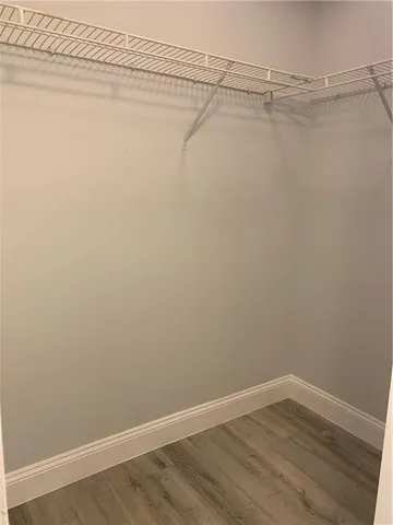 a view of a room with racks on the wall