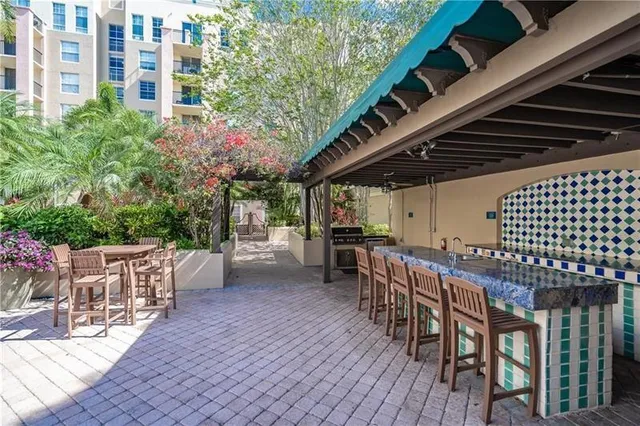 a view of a chairs and table in wooden deck