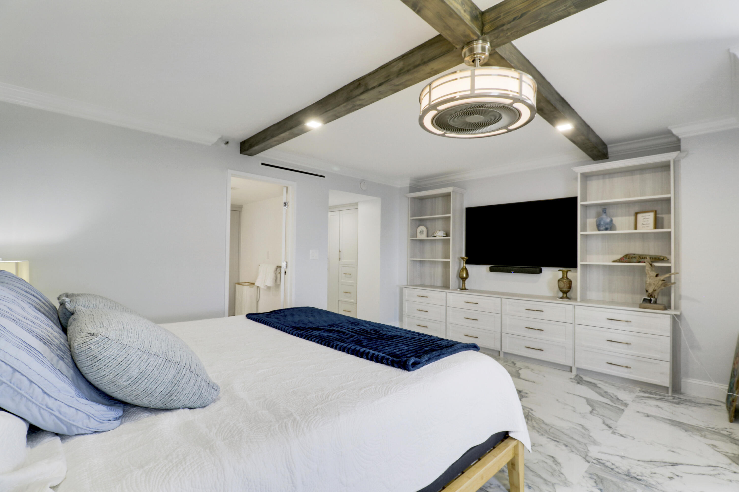 5280 North Ocean Drive, Unit 2F Riviera Beach, FL 33404 - Photo 14 of 35 a bedroom with a bed and a flat screen tv