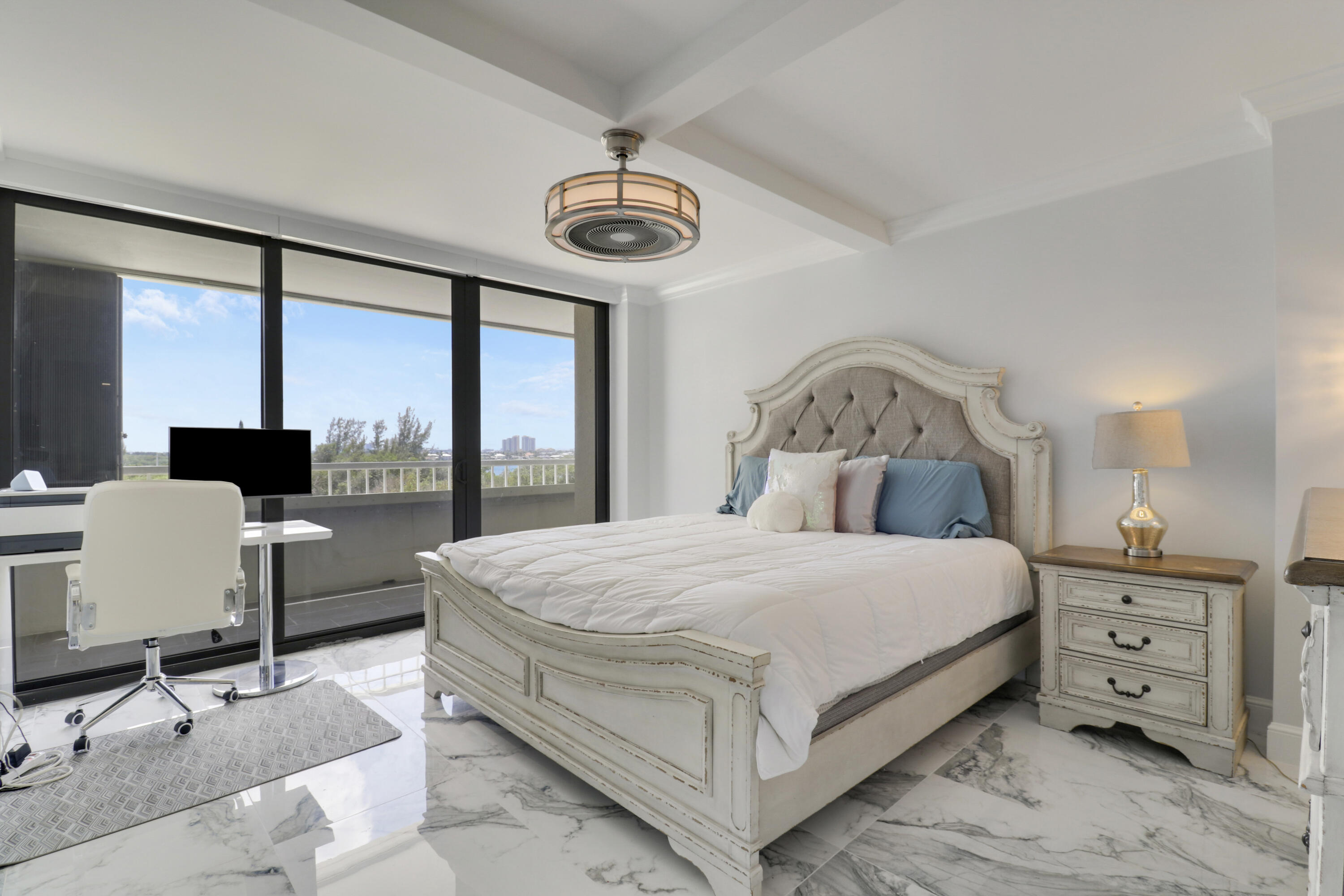 5280 North Ocean Drive, Unit 2F Riviera Beach, FL 33404 - Photo 17 of 35 a bedroom with a bed and a large window