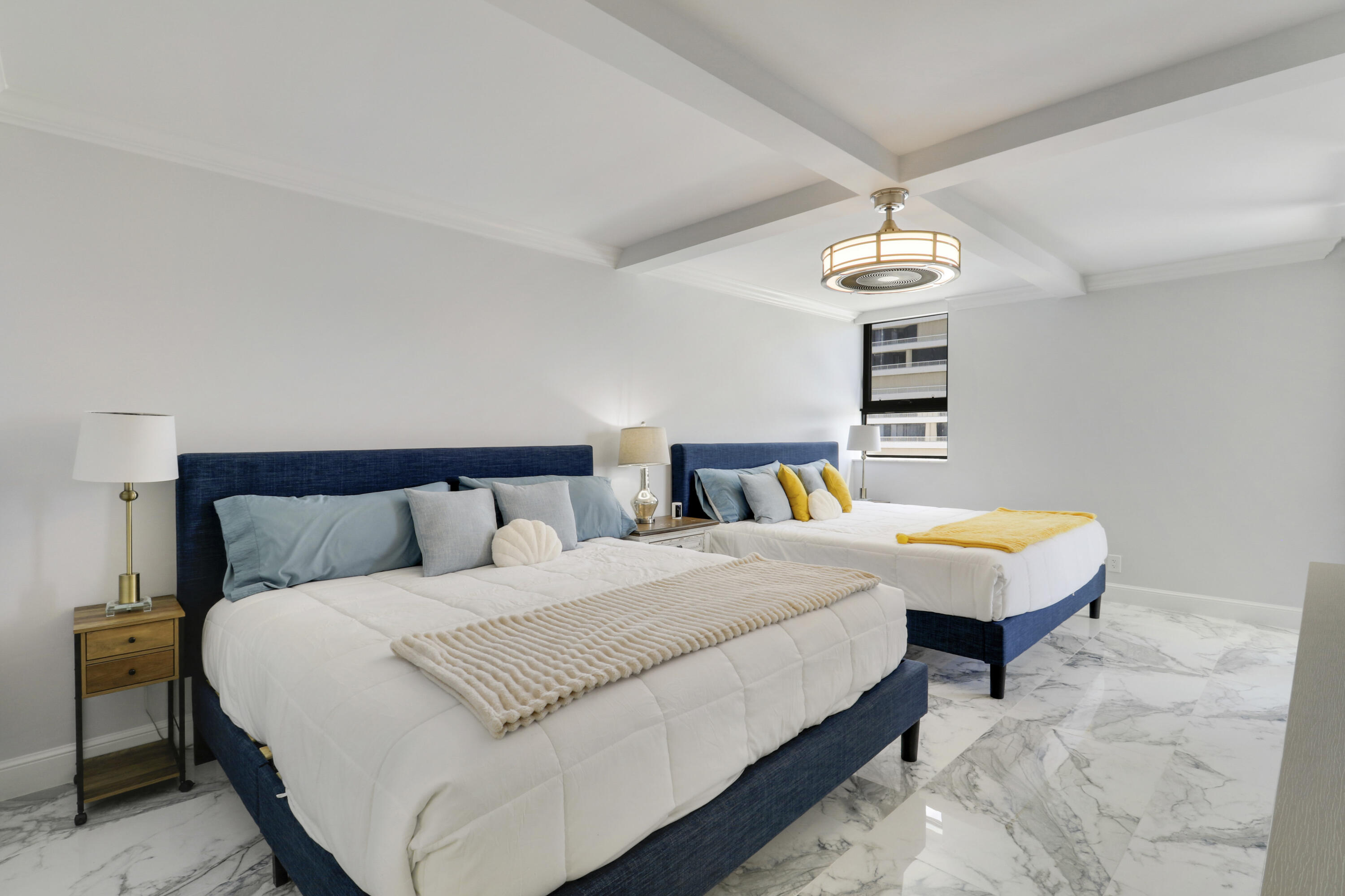 5280 North Ocean Drive, Unit 2F Riviera Beach, FL 33404 - Photo 19 of 35 a bedroom with bed and a chandelier