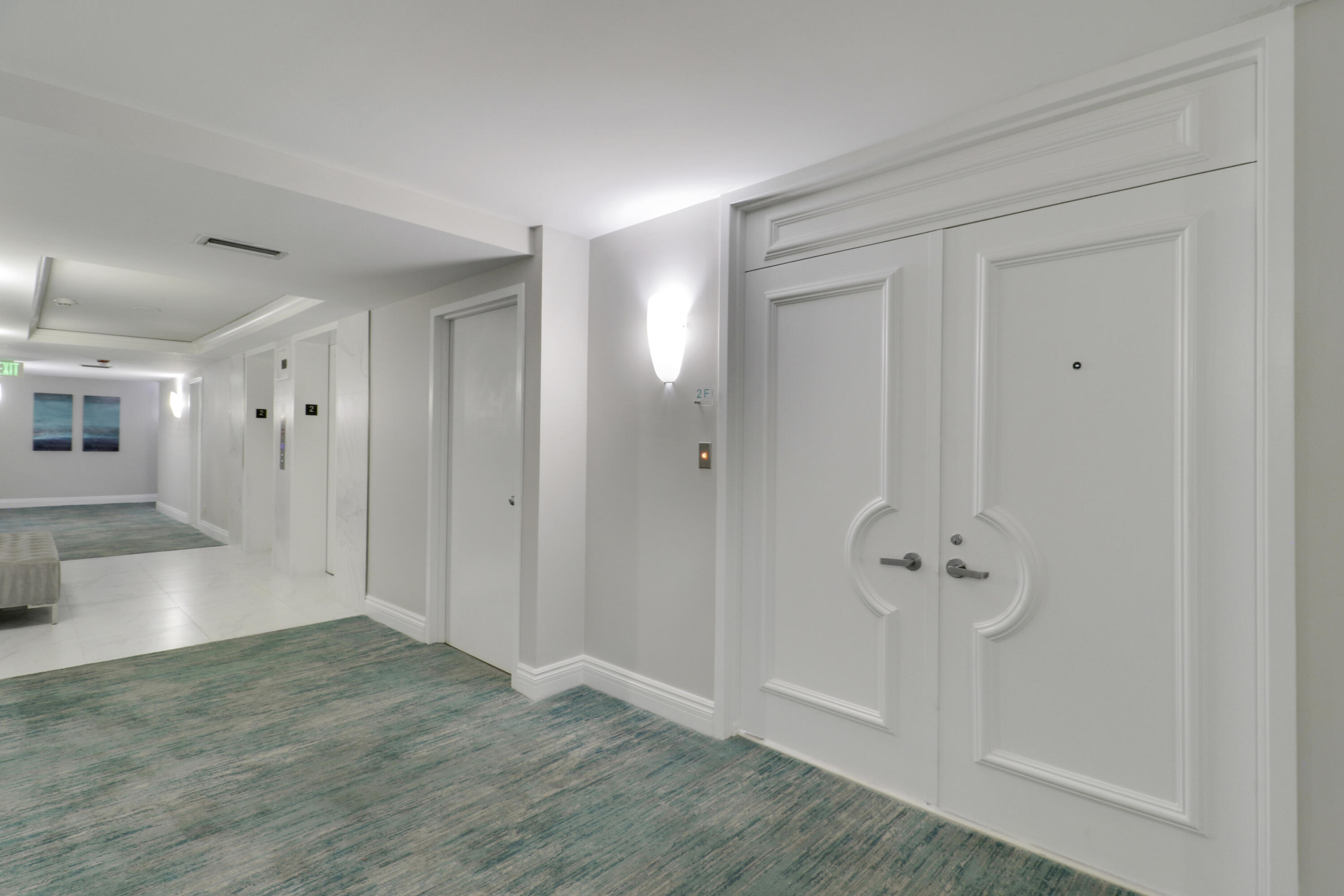 5280 North Ocean Drive, Unit 2F Riviera Beach, FL 33404 - Photo 24 of 35 a view of a hallway with wooden floor