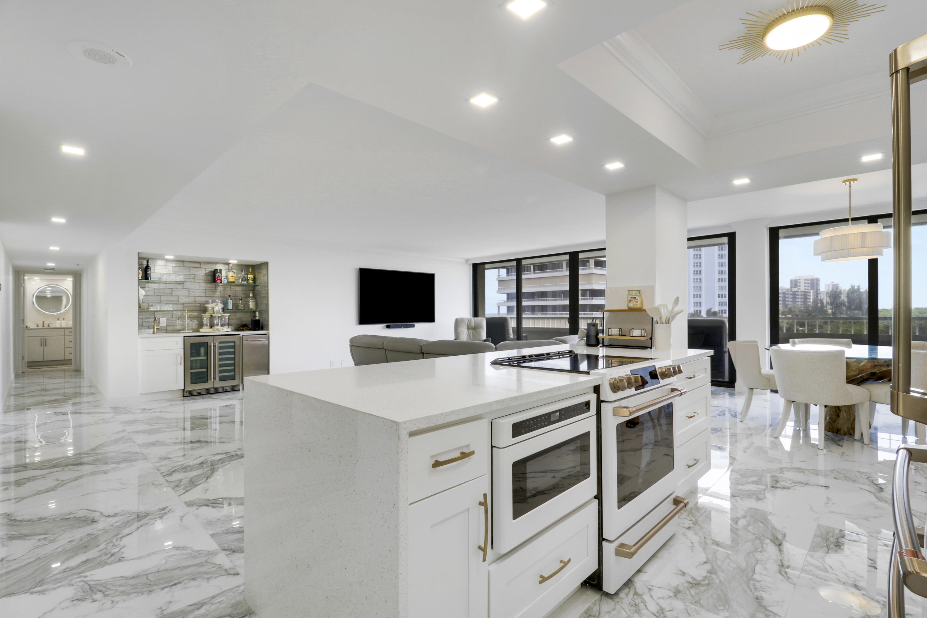 5280 North Ocean Drive, Unit 2F Riviera Beach, FL 33404 - Photo 3 of 35 a kitchen that has a stove and a microwave