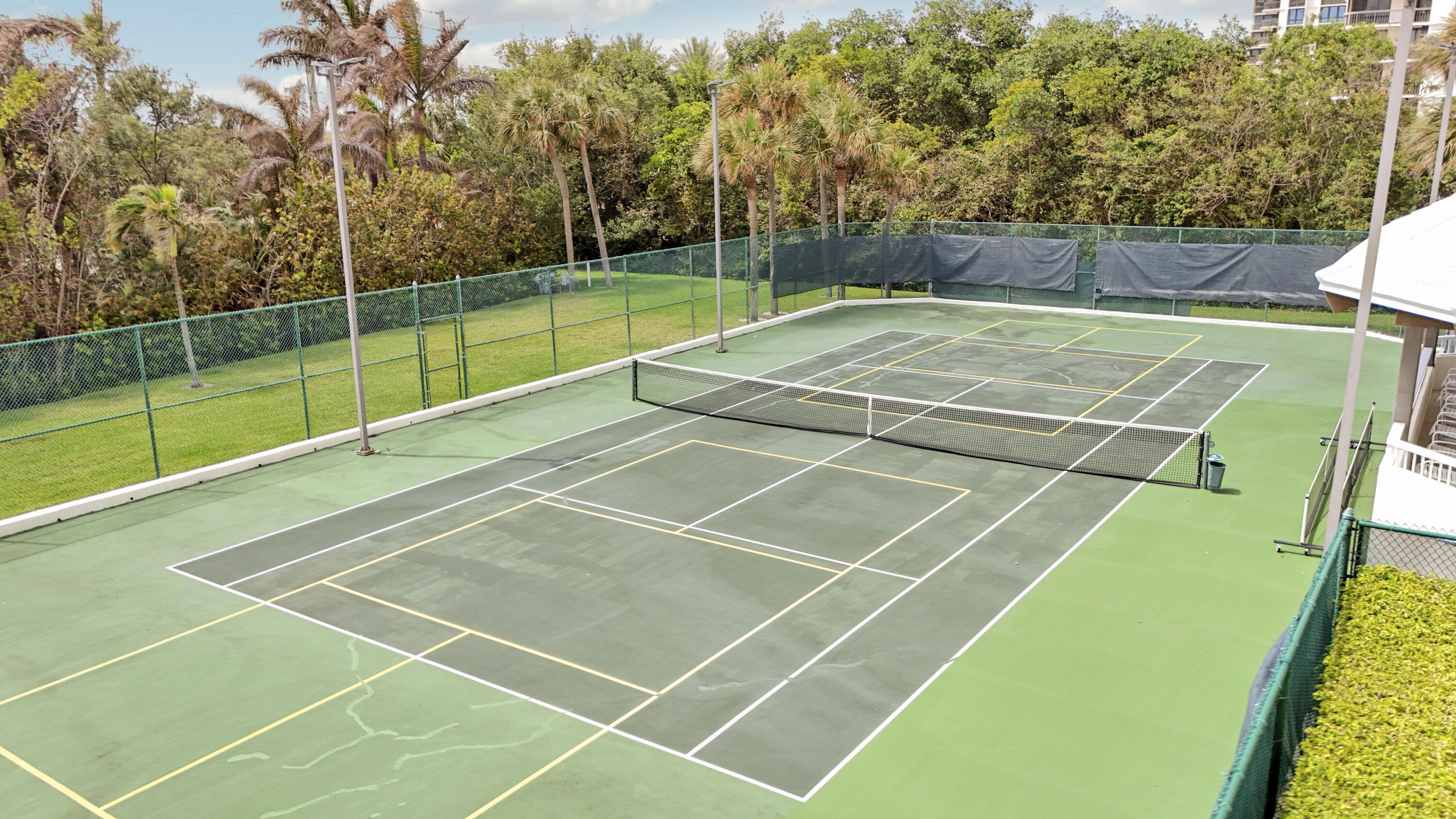 5280 North Ocean Drive, Unit 2F Riviera Beach, FL 33404 - Photo 34 of 35 a tennis court that has tennis net