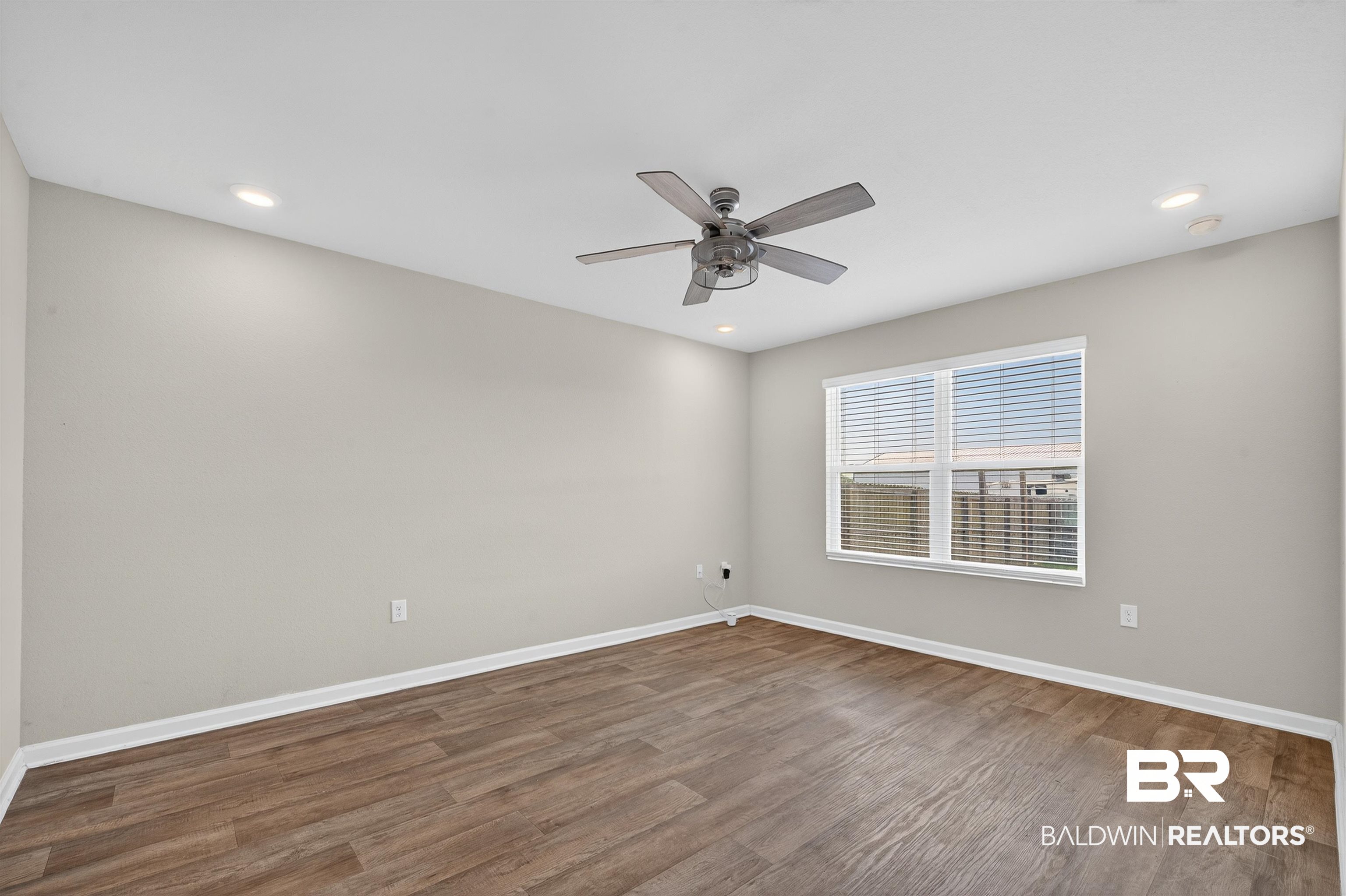 7429 Brompton Drive Foley, AL 36535 - Photo 19 of 50 Empty room featuring light wood-style floors, recessed lighting, and ceiling fan
