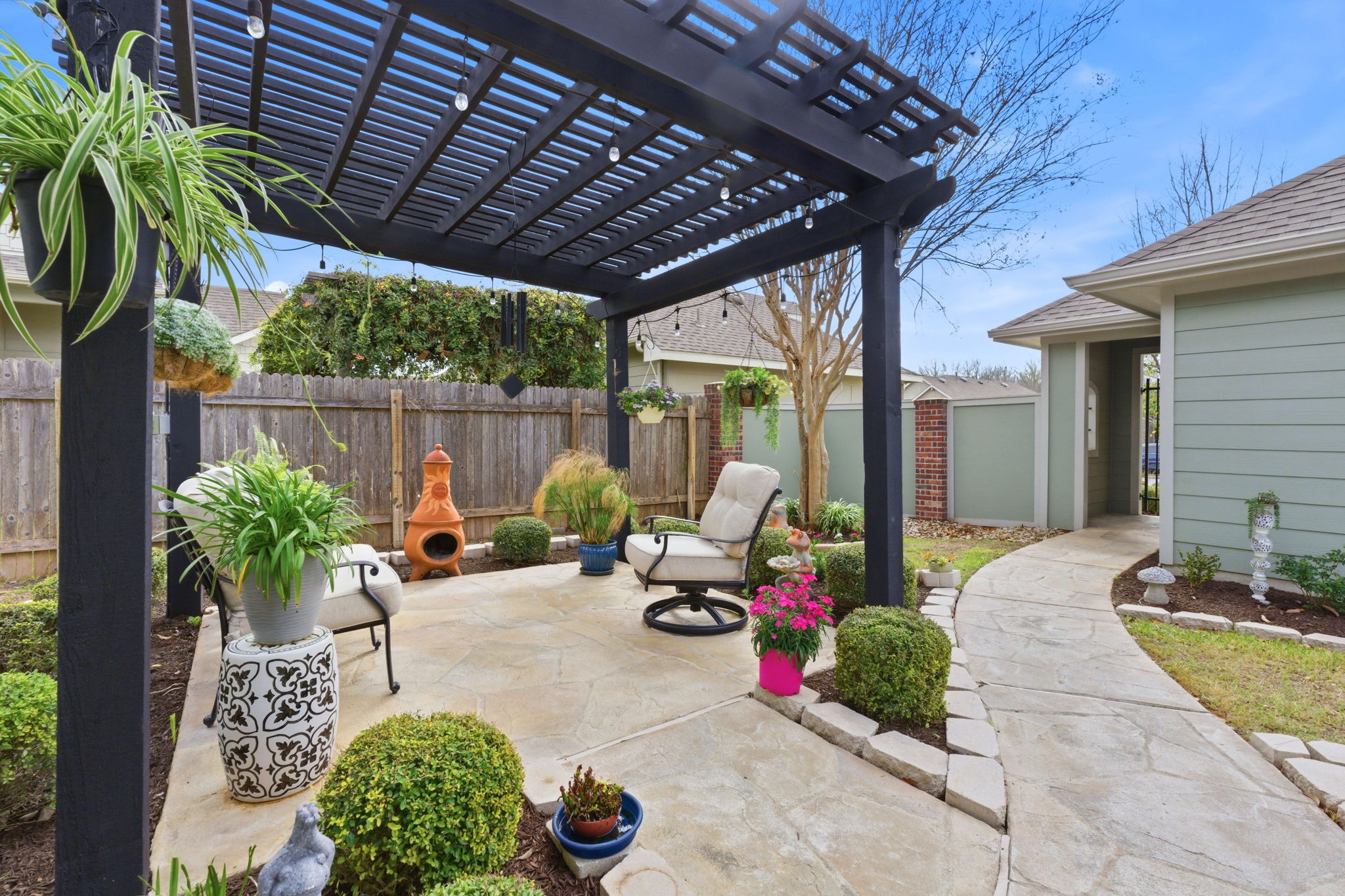 426 Tilly Lane Buda, TX 78610 - Photo 16 of 21 Fenced backyard featuring a pergola, a patio area, and a storage shed