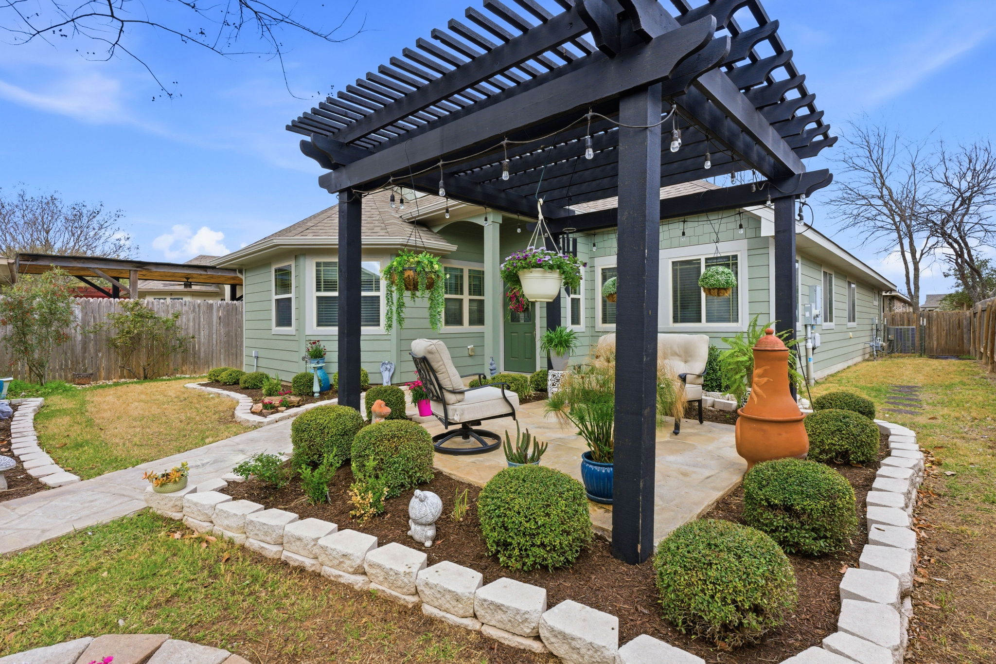 426 Tilly Lane Buda, TX 78610 - Photo 17 of 21 Back of property with a patio area and a pergola