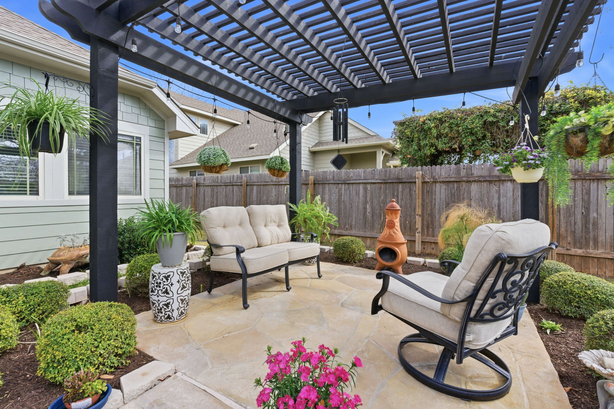 426 Tilly Lane Buda, TX 78610 - Photo 2 of 21 Fenced backyard with a patio, a pergola, and an outdoor living space