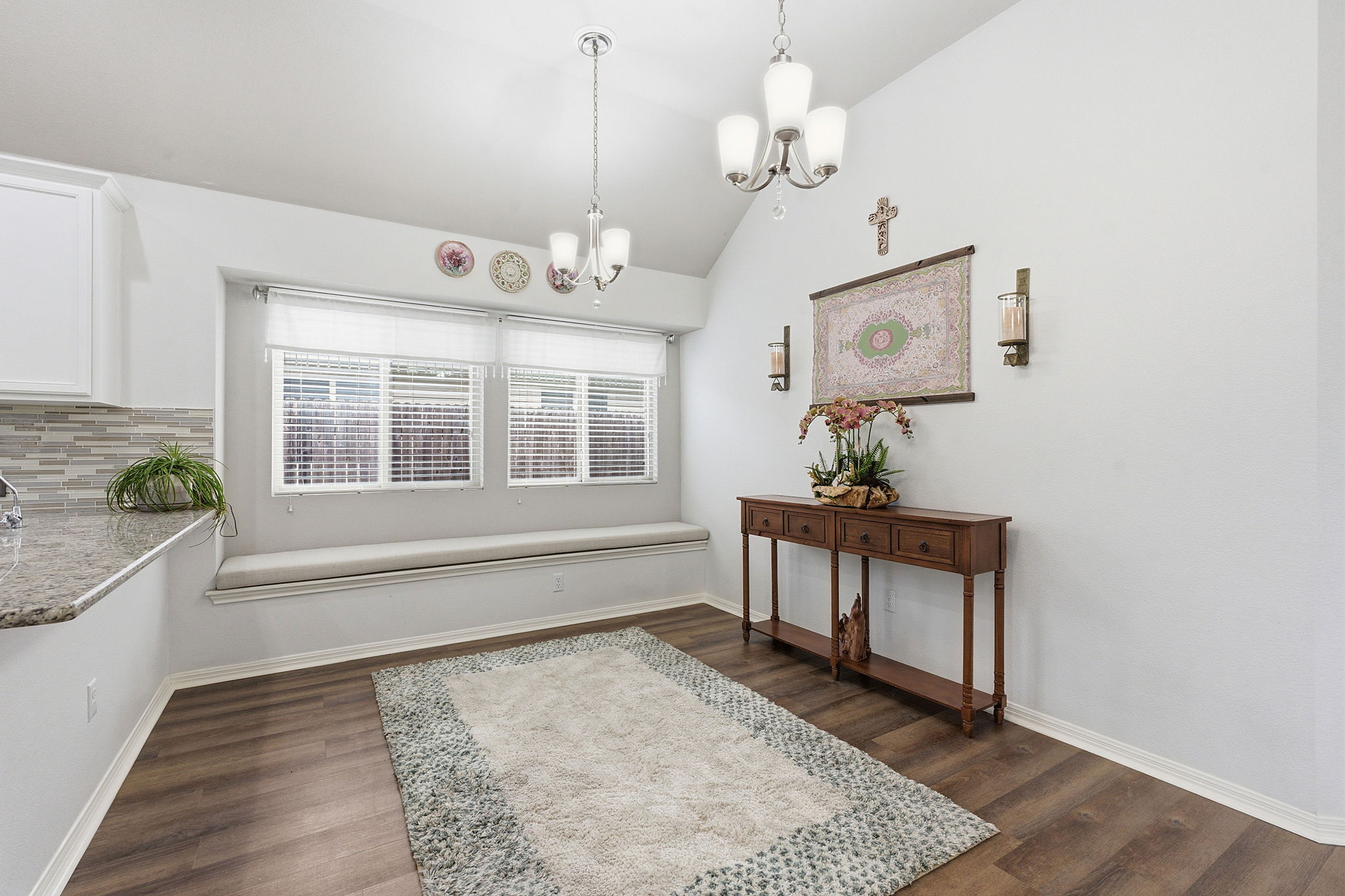 426 Tilly Lane Buda, TX 78610 - Photo 9 of 21 Dining space with hanging lights, lofted ceiling, and dark wood-type flooring