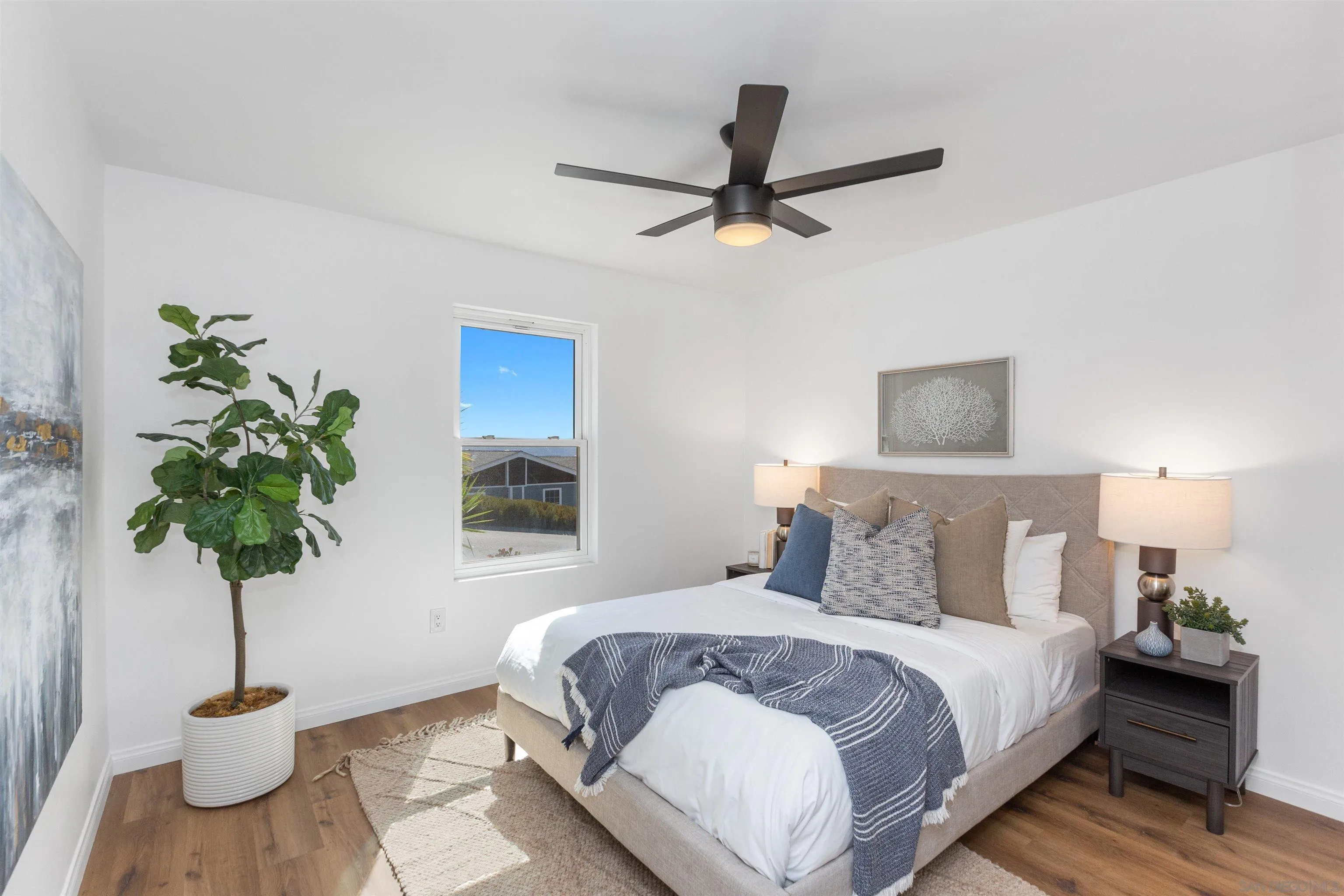 12694 Jackson Heights Drive El Cajon, CA 92021 - Photo 13 of 29 a bedroom with a bed and a potted plant