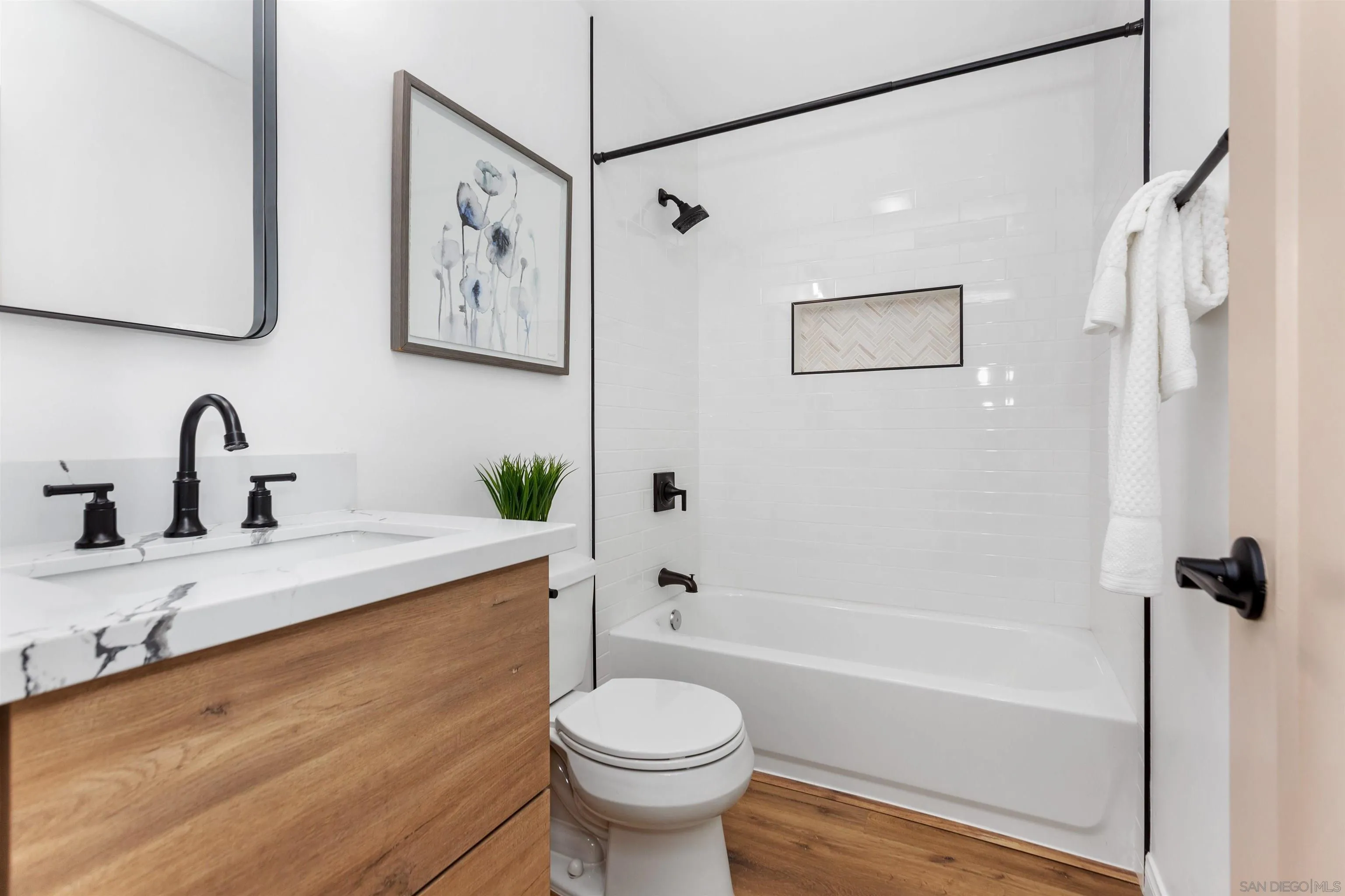 12694 Jackson Heights Drive El Cajon, CA 92021 - Photo 14 of 29 a bathroom with a sink toilet and shower