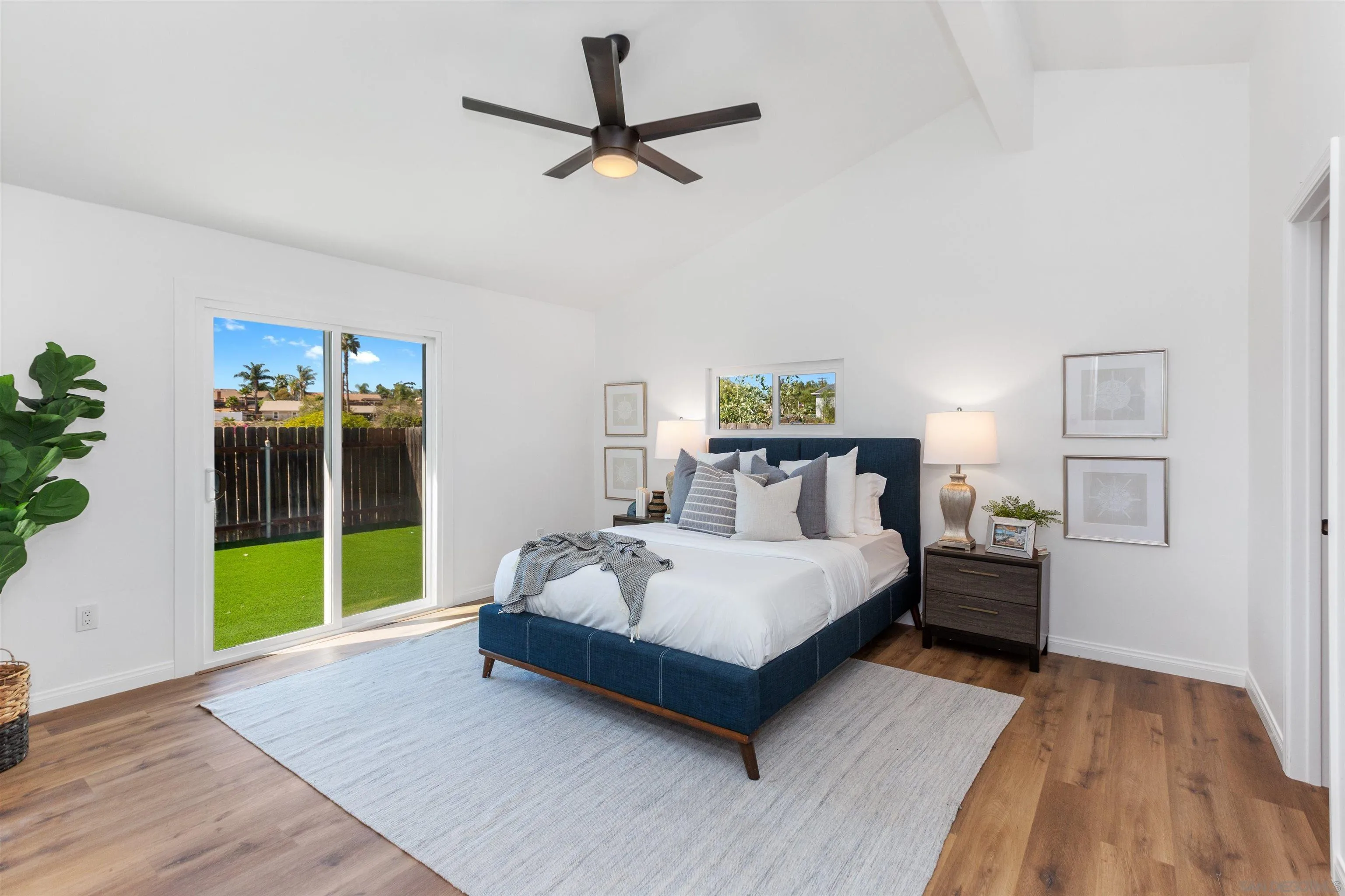 12694 Jackson Heights Drive El Cajon, CA 92021 - Photo 17 of 29 a spacious bedroom with a bed and a table