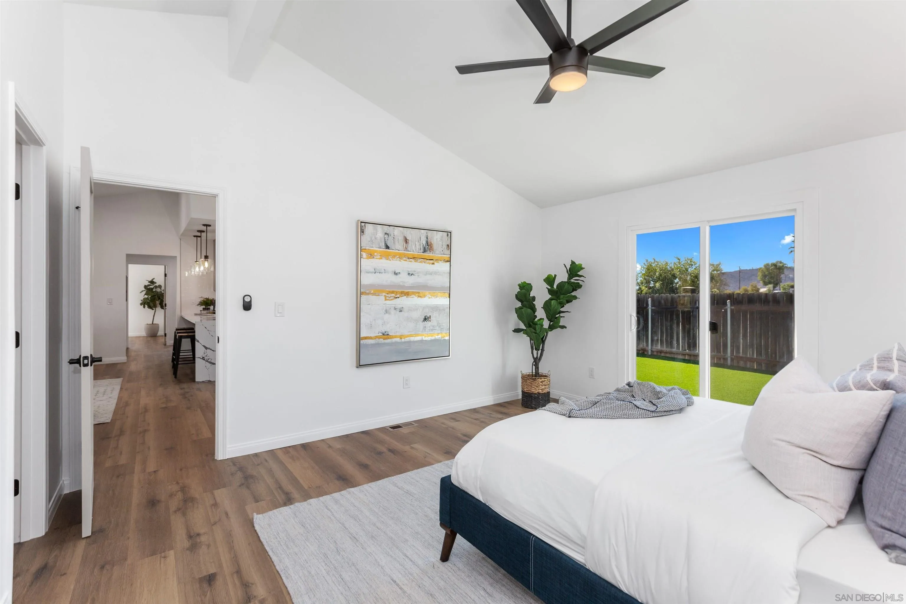 12694 Jackson Heights Drive El Cajon, CA 92021 - Photo 18 of 29 a bedroom with a bed and a chandelier