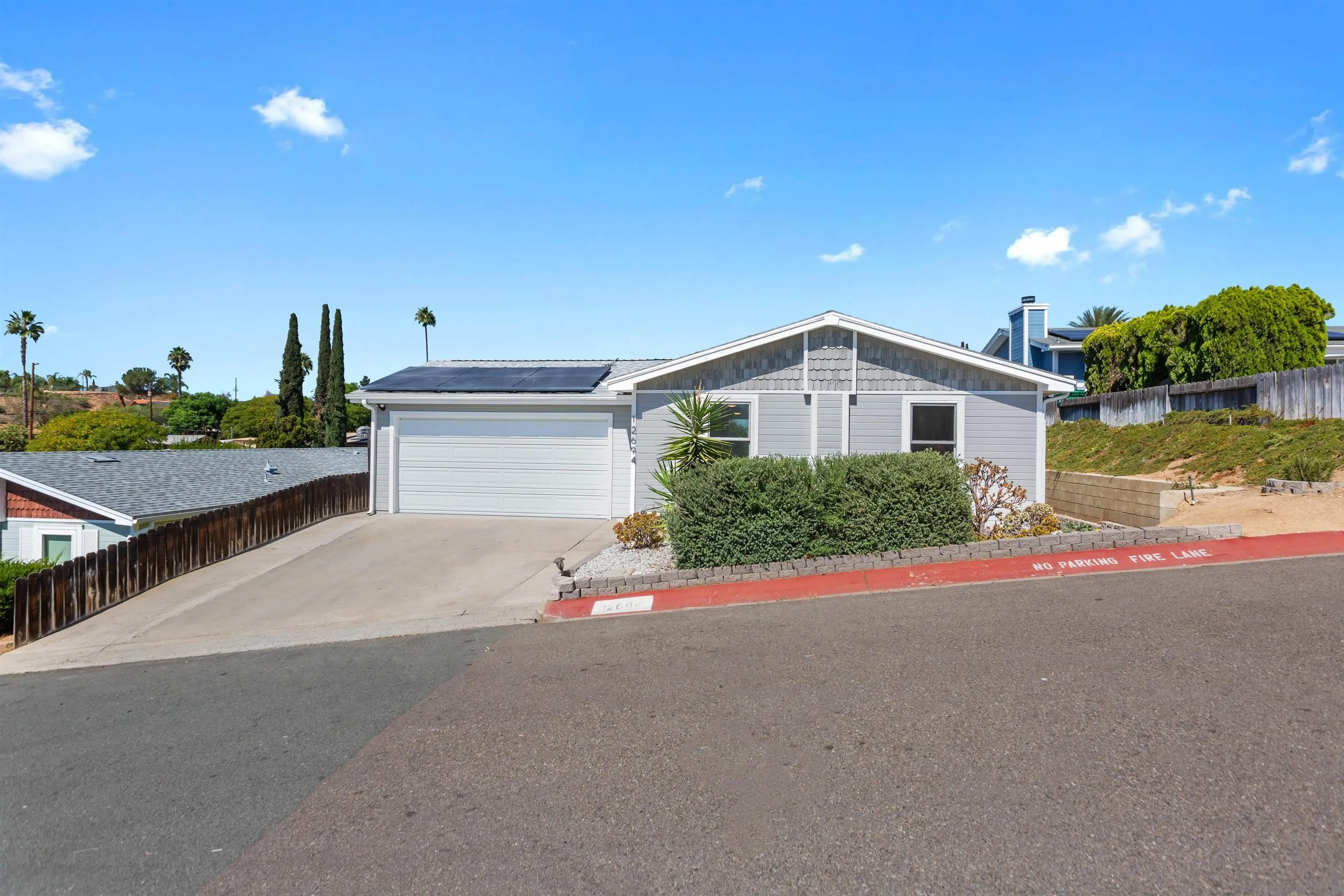 12694 Jackson Heights Drive El Cajon, CA 92021 - Photo 2 of 29 a view of a house with a street
