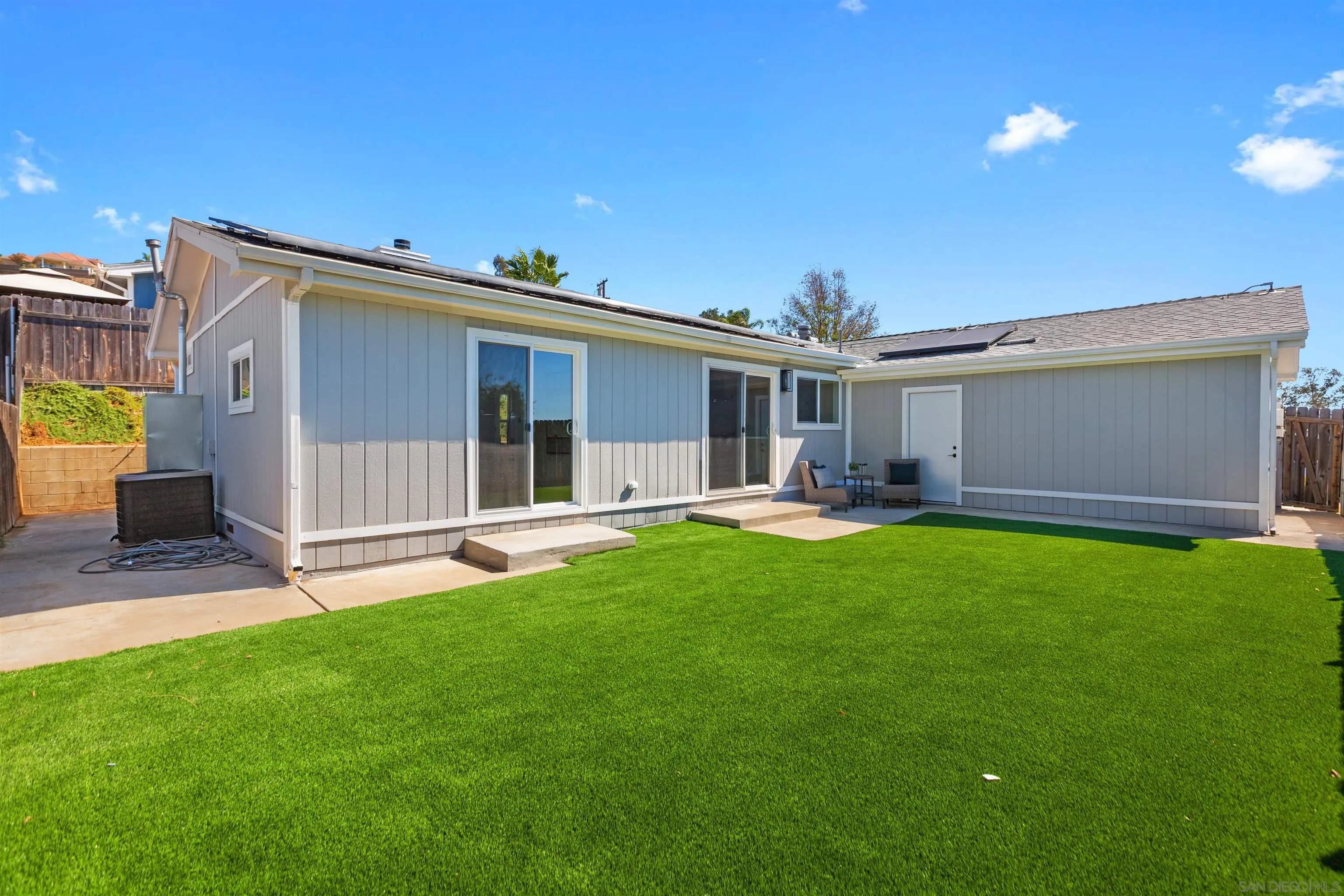 12694 Jackson Heights Drive El Cajon, CA 92021 - Photo 26 of 29 a view of a house with backyard and a tree