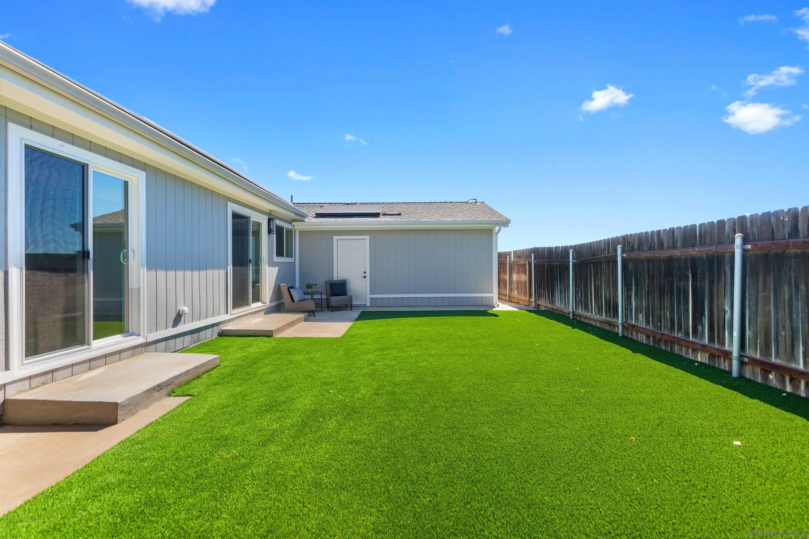 12694 Jackson Heights Drive El Cajon, CA 92021 - Photo 27 of 29 a backyard of a house with table and chairs