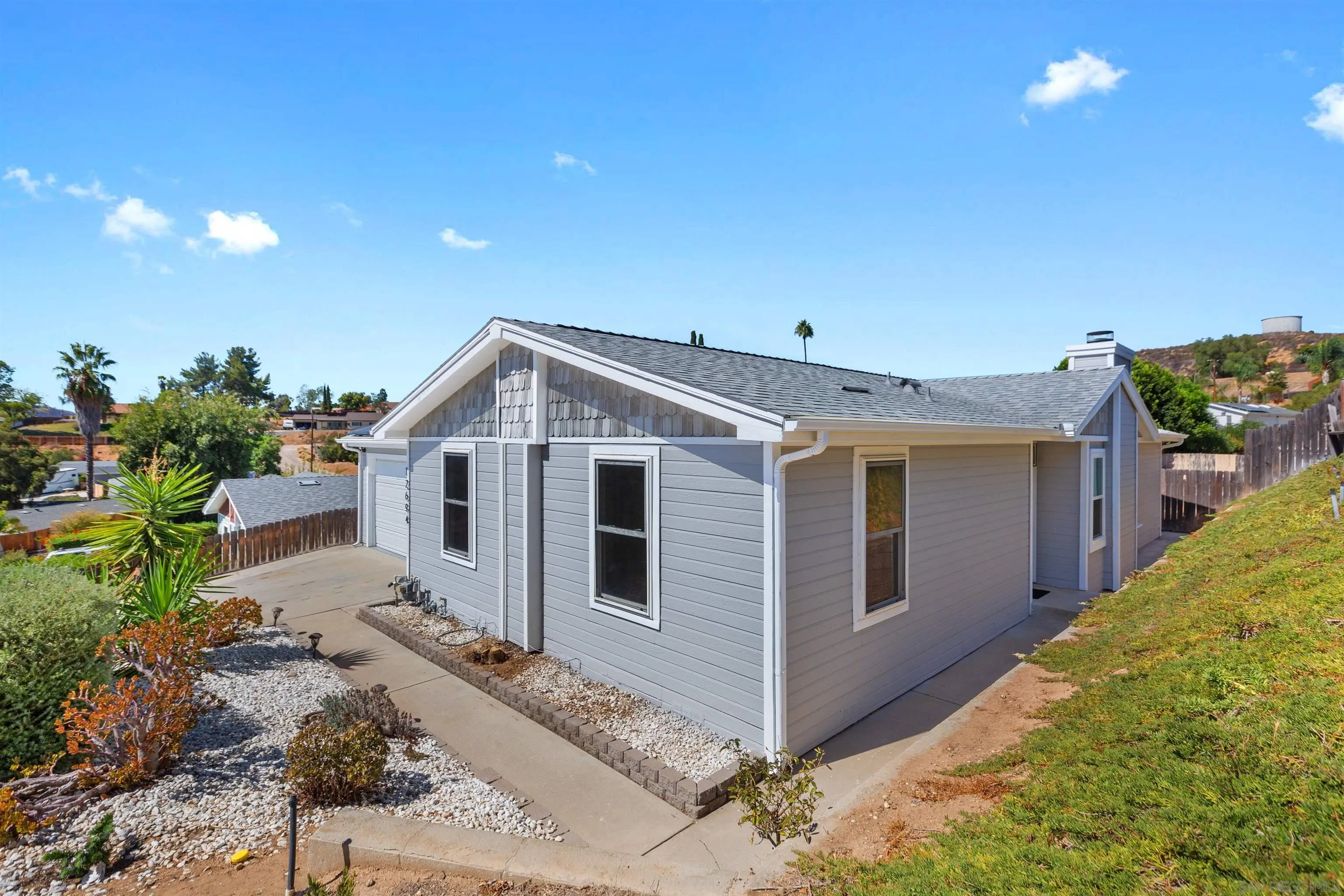 12694 Jackson Heights Drive El Cajon, CA 92021 - Photo 28 of 29 a view of a house with a backyard