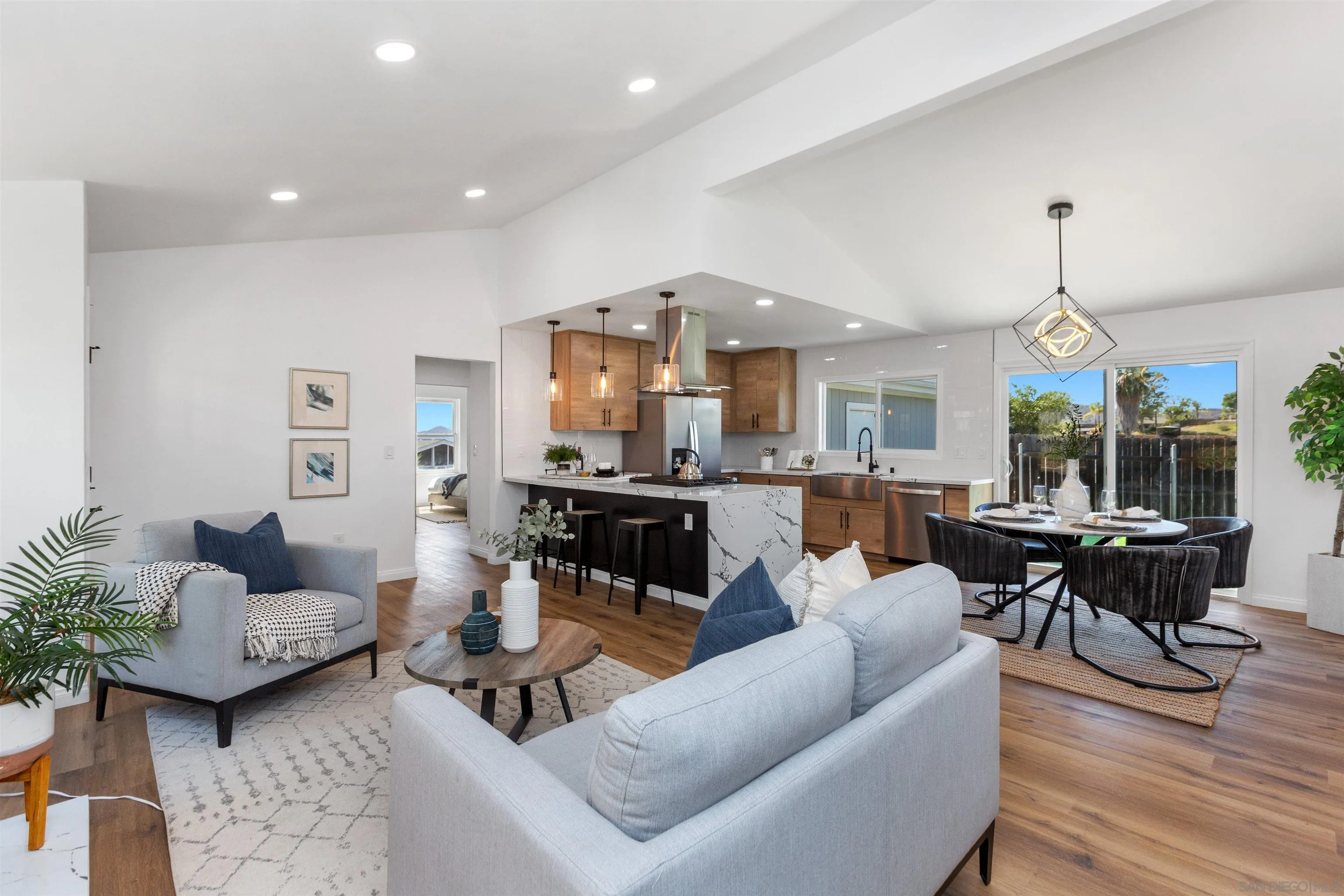 12694 Jackson Heights Drive El Cajon, CA 92021 - Photo 4 of 29 a living room with furniture and wooden floor