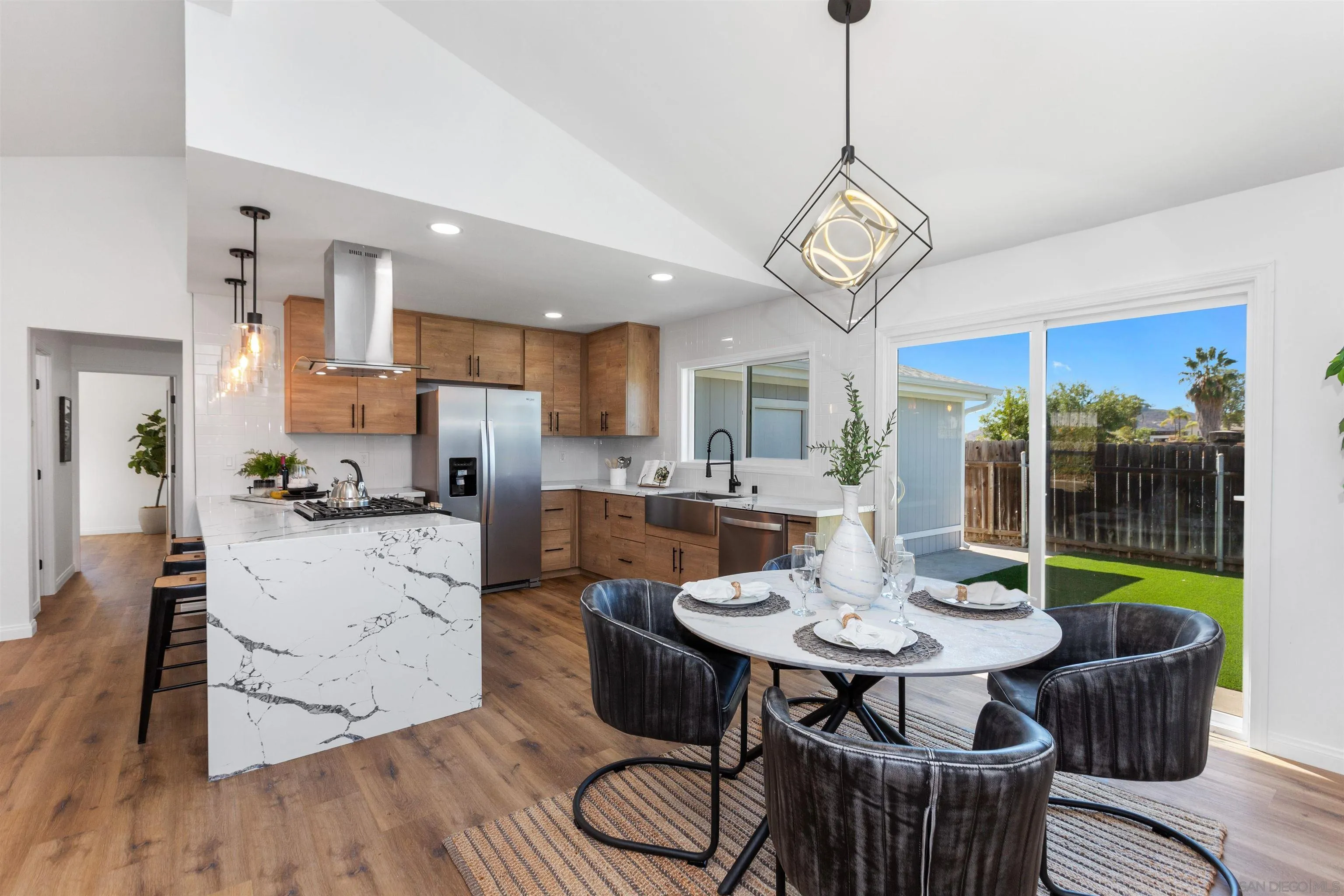 12694 Jackson Heights Drive El Cajon, CA 92021 - Photo 9 of 29 a view of a dining room with furniture window and wooden floor