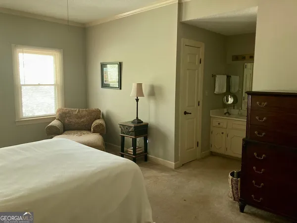 a bedroom with a bed and a closet